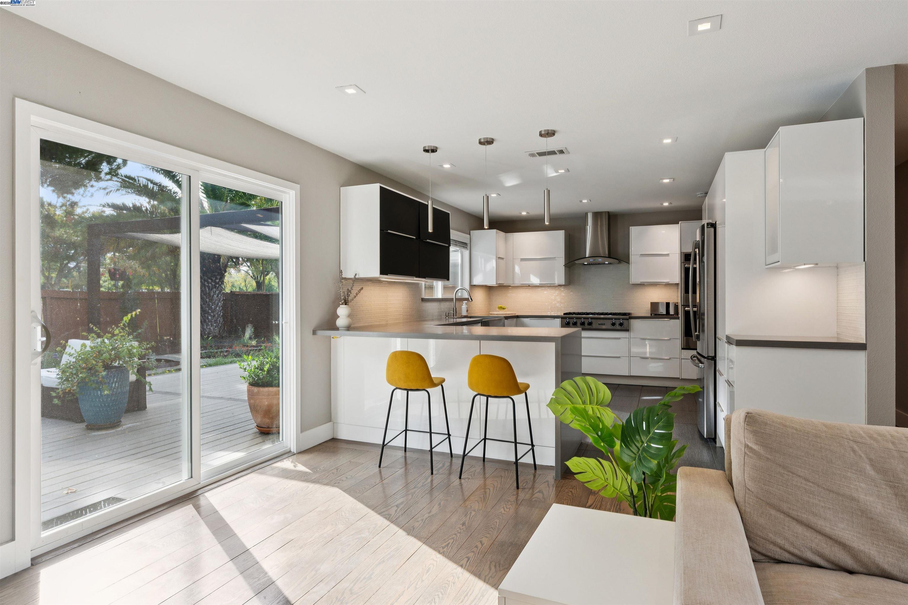 1230 Hale Drive Concord, CA 94518 - Photo 14 of 60 a kitchen with stainless steel appliances kitchen island granite countertop a refrigerator and a dining table