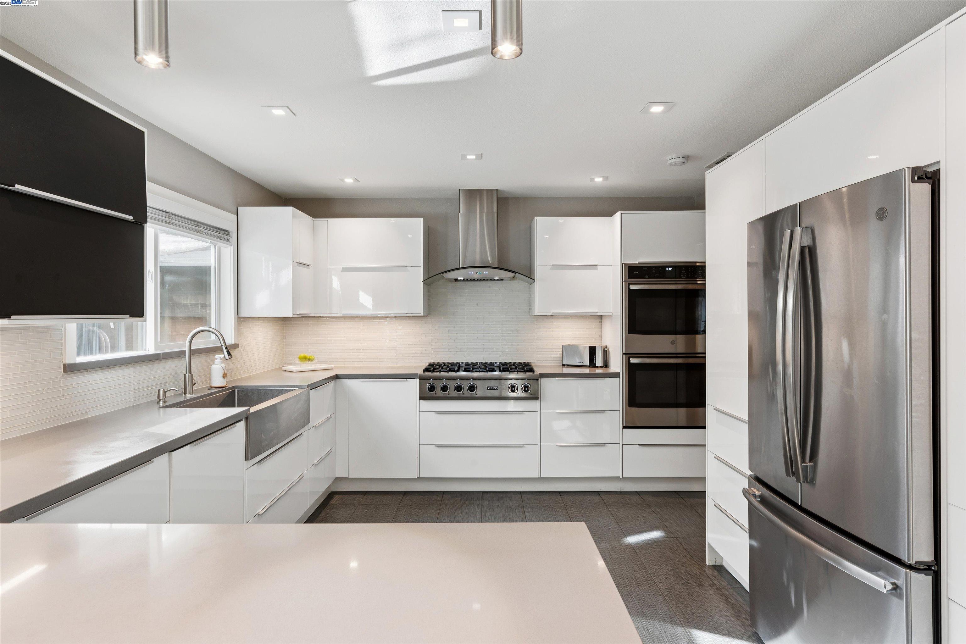 1230 Hale Drive Concord, CA 94518 - Photo 16 of 60 a kitchen with stainless steel appliances granite countertop a stove a refrigerator and a sink