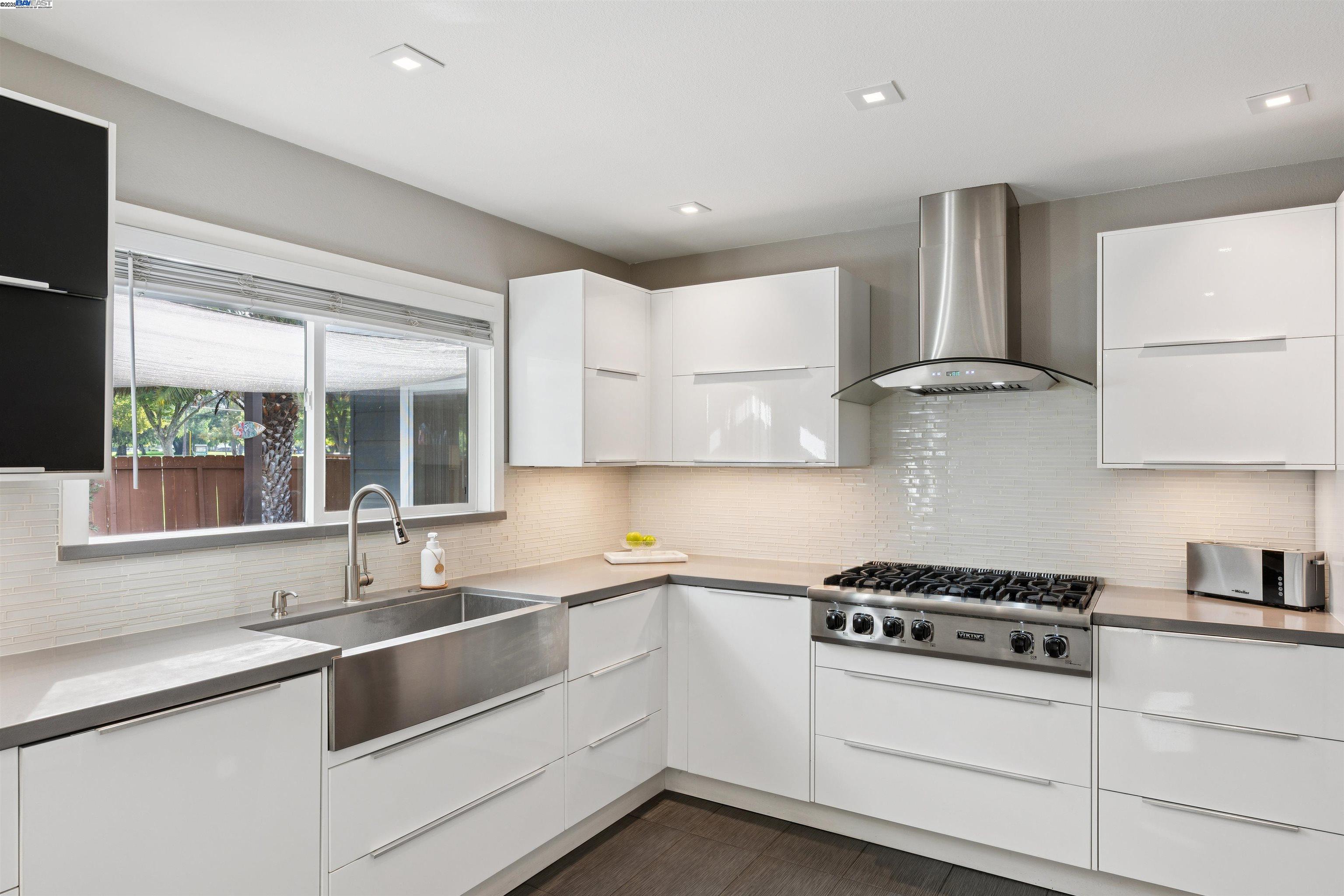 1230 Hale Drive Concord, CA 94518 - Photo 17 of 60 a kitchen with granite countertop a sink appliances cabinets and a counter top space