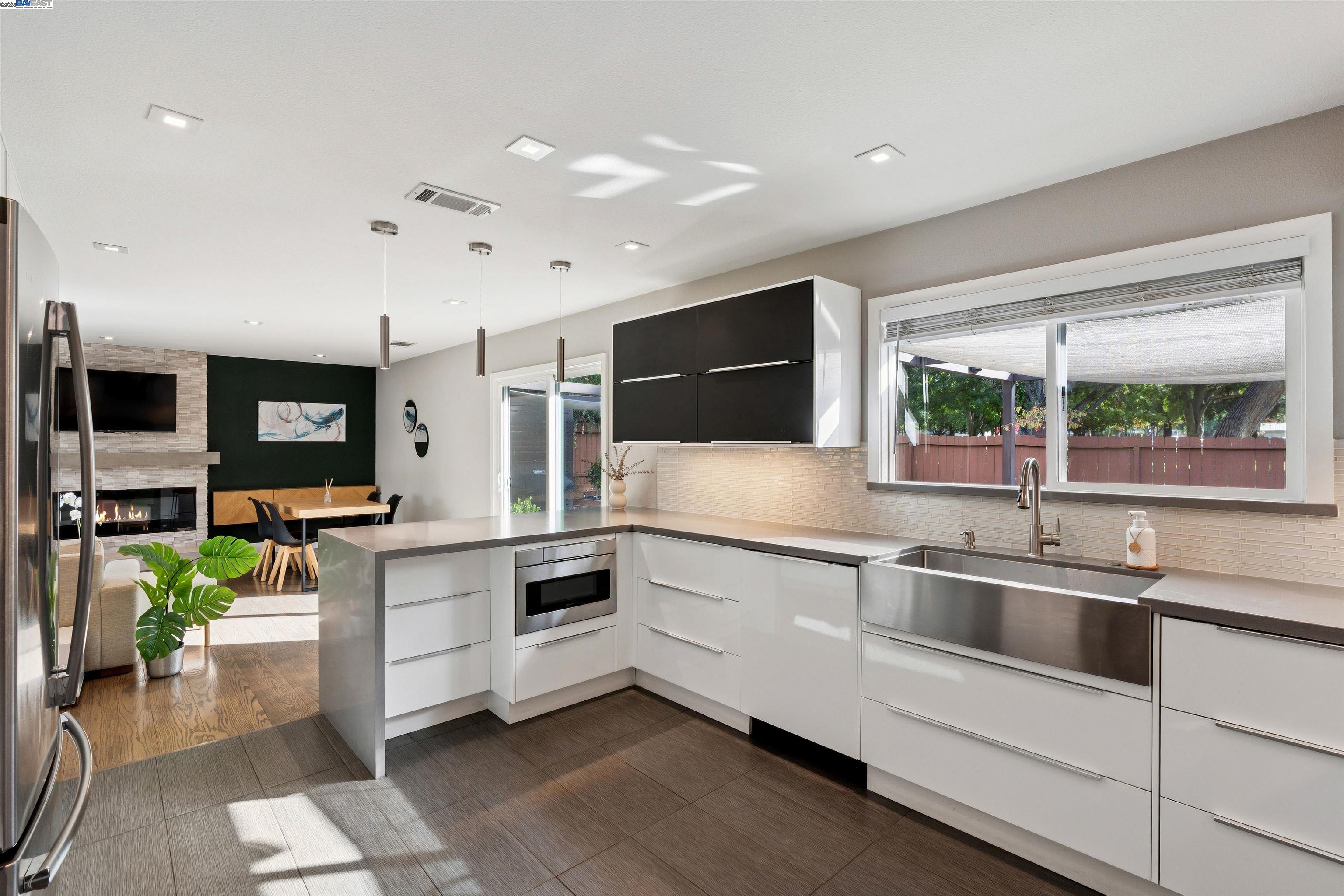 1230 Hale Drive Concord, CA 94518 - Photo 20 of 60 a kitchen with stainless steel appliances kitchen island granite countertop a sink and white cabinets