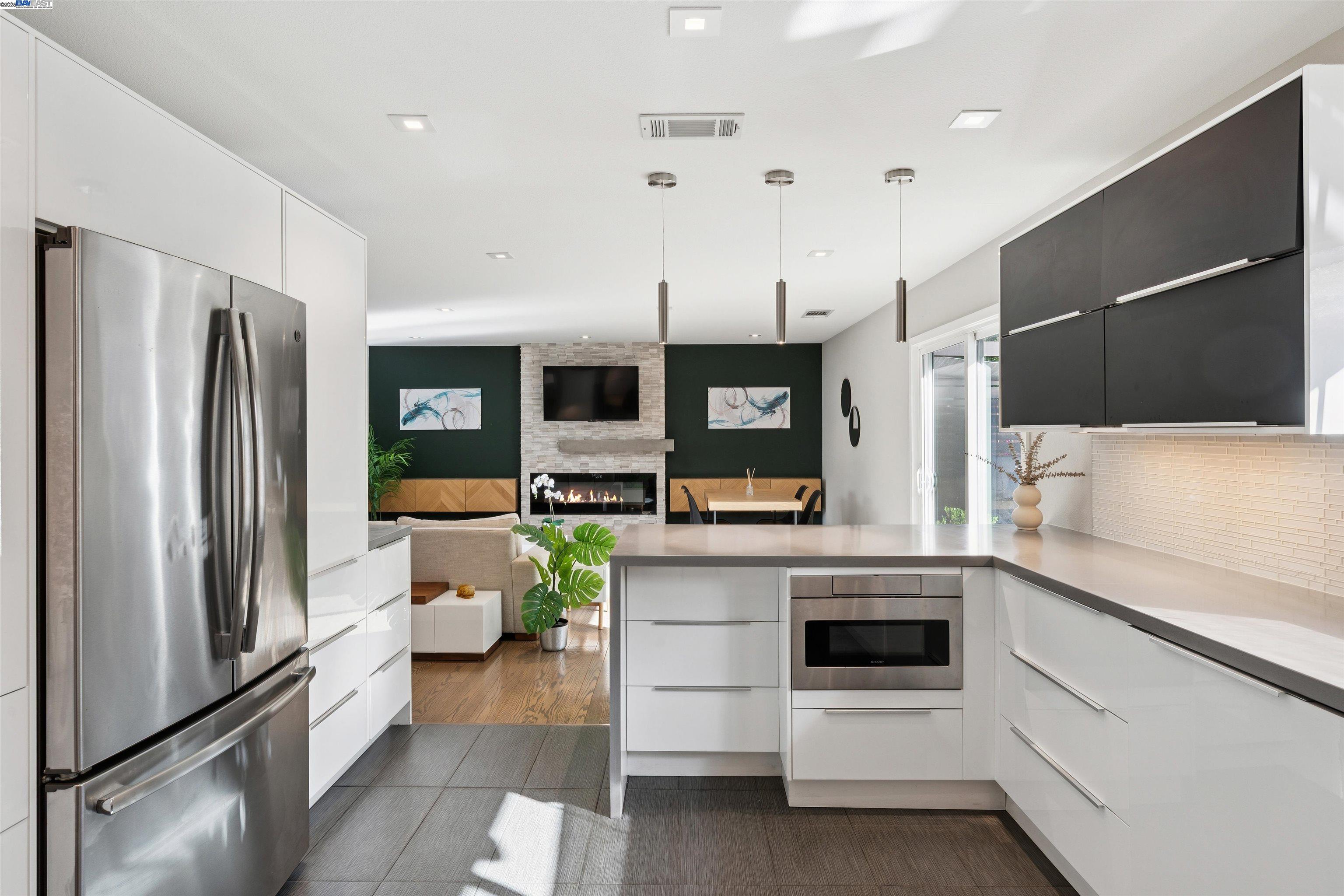 1230 Hale Drive Concord, CA 94518 - Photo 22 of 60 a kitchen with a refrigerator and white cabinets
