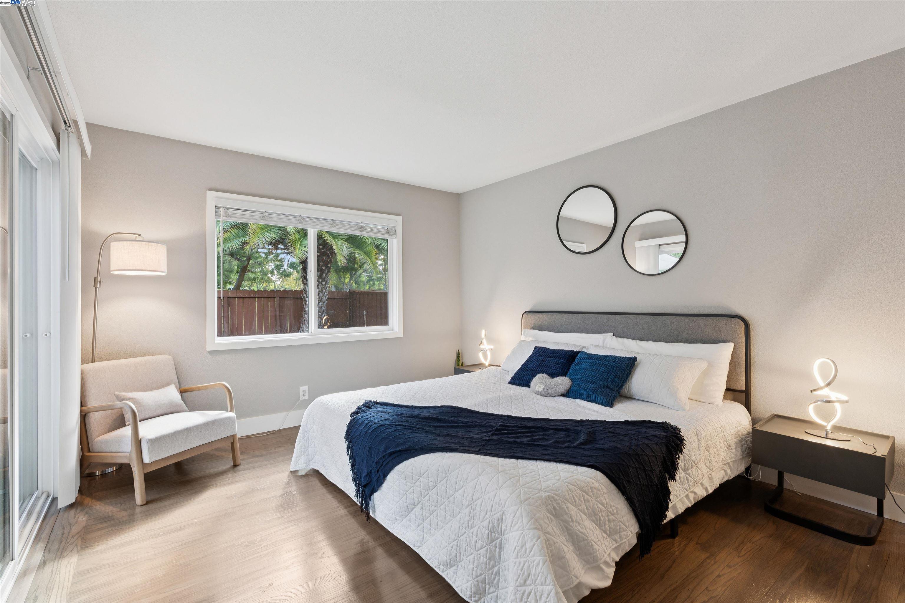 1230 Hale Drive Concord, CA 94518 - Photo 23 of 60 a bedroom with a bed and a lamp next to a window