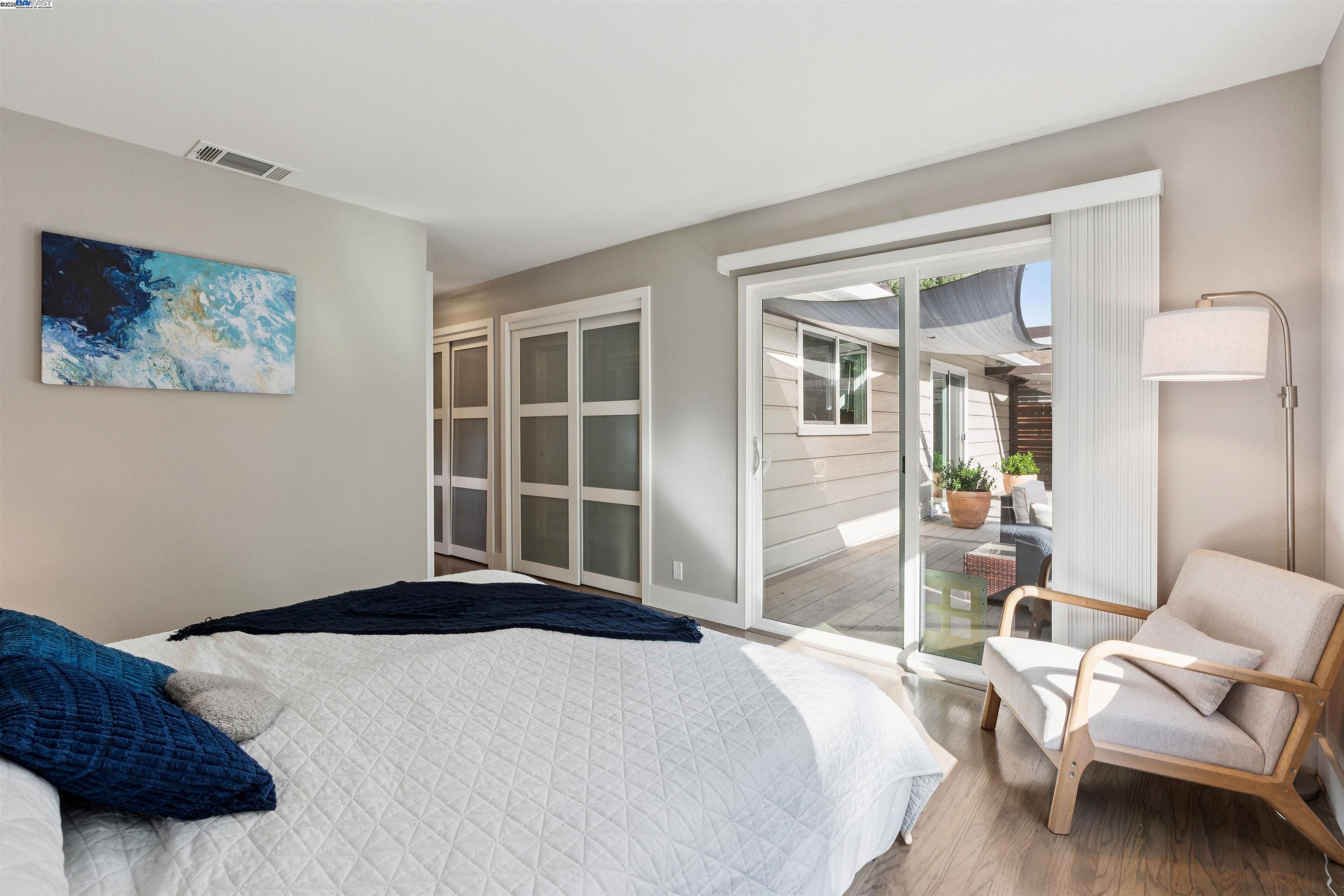 1230 Hale Drive Concord, CA 94518 - Photo 25 of 60 a bedroom with a bed and wooden floor