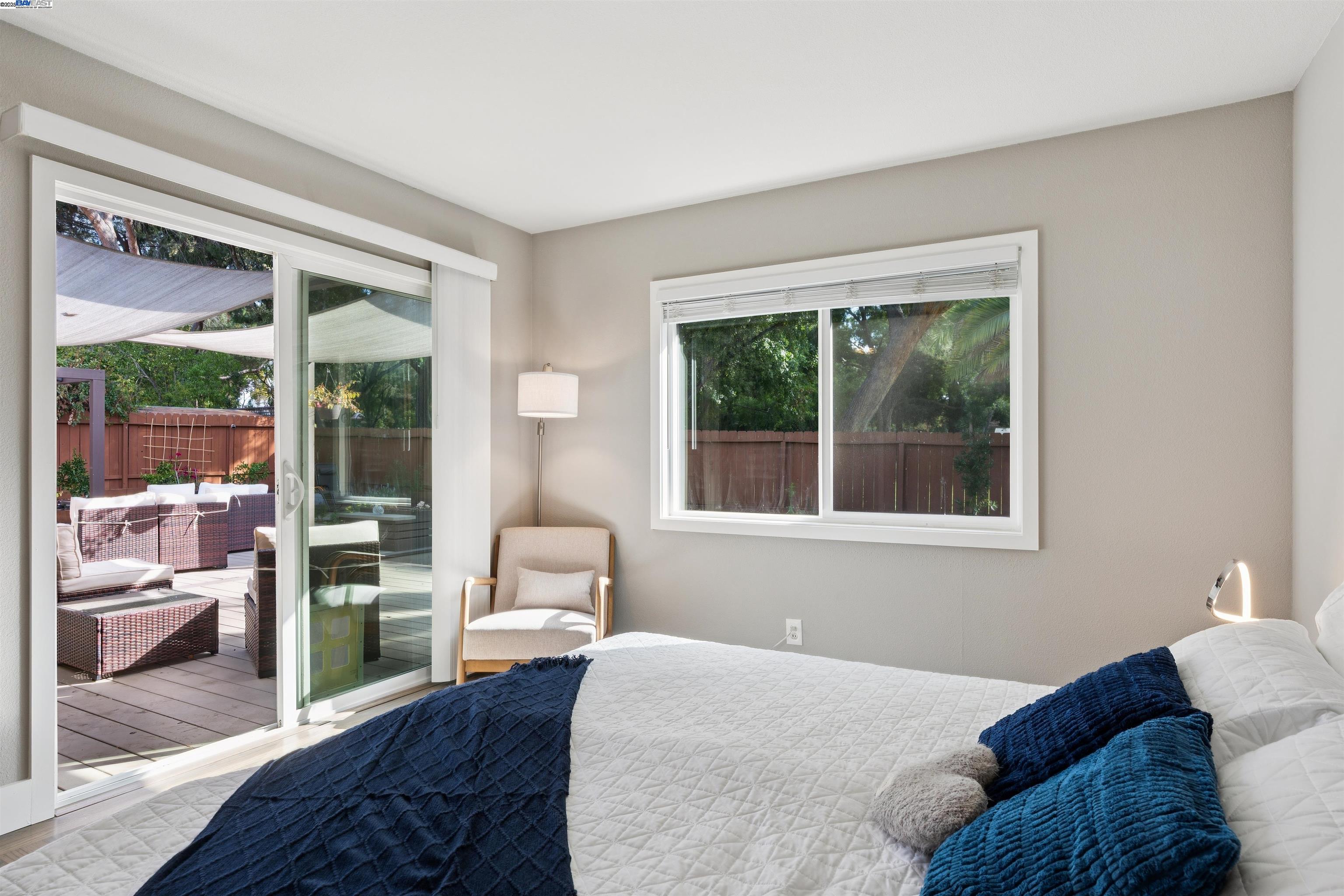 1230 Hale Drive Concord, CA 94518 - Photo 26 of 60 a bedroom with a bed and wooden floor