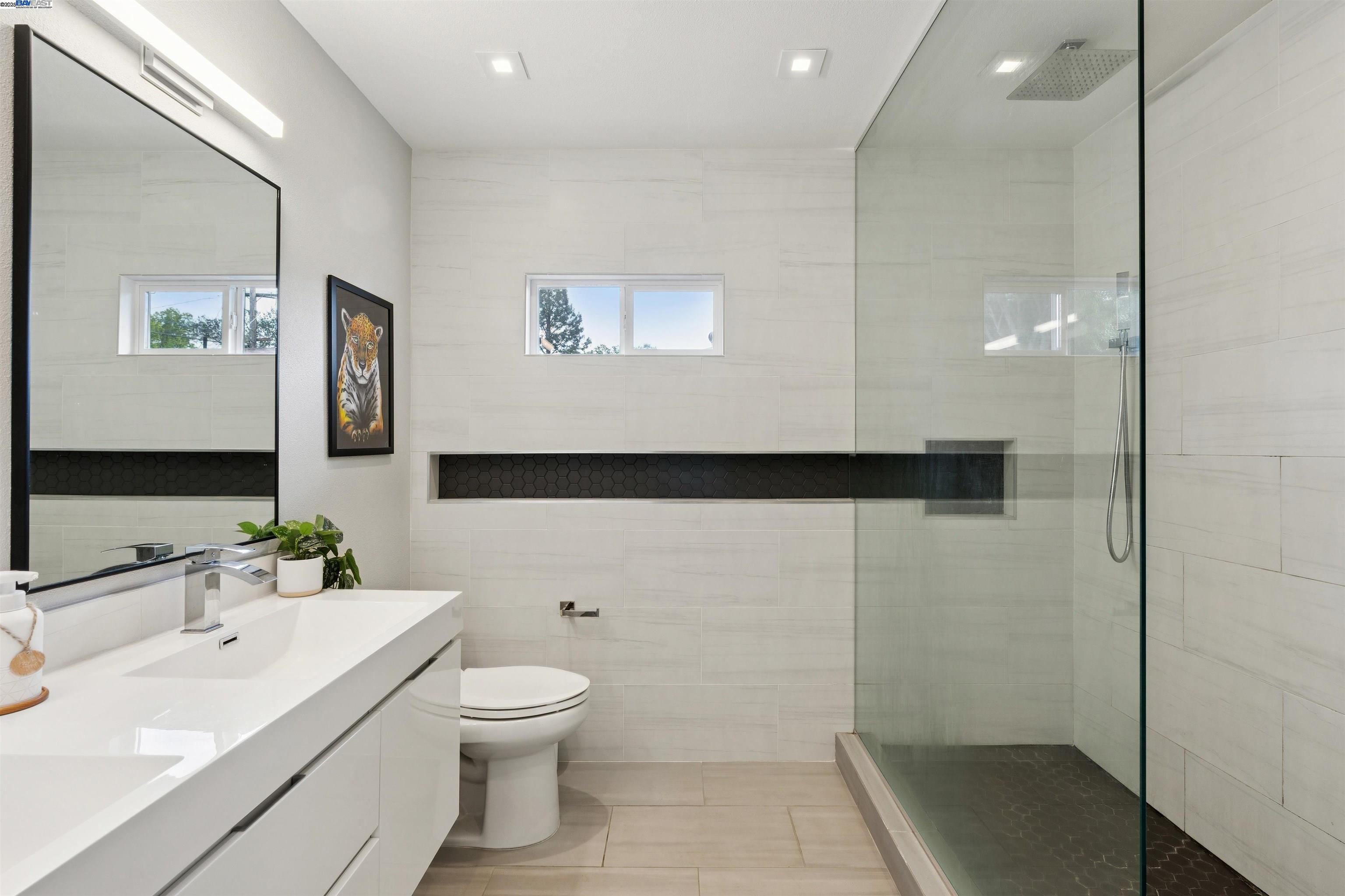 1230 Hale Drive Concord, CA 94518 - Photo 27 of 60 a bathroom with a toilet a sink and mirror