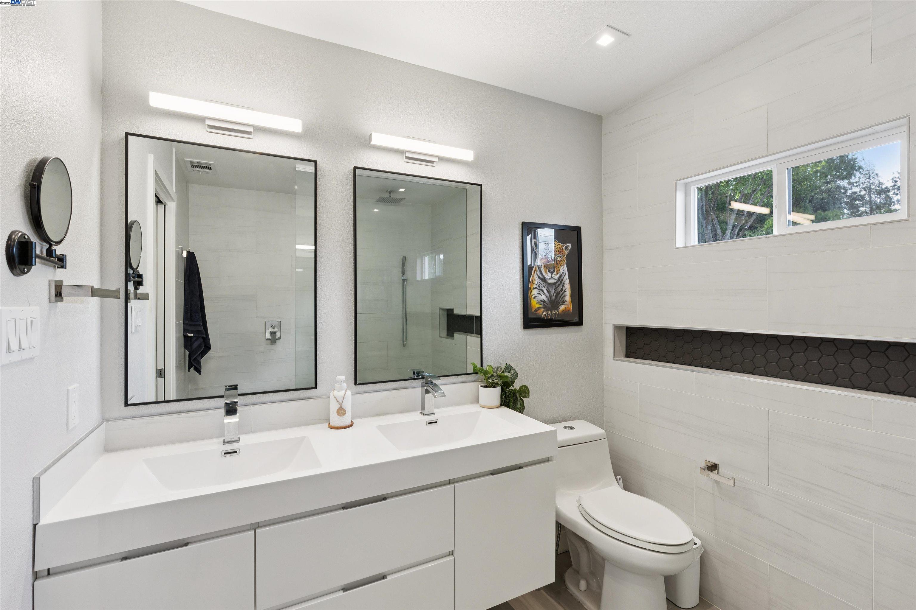 1230 Hale Drive Concord, CA 94518 - Photo 28 of 60 a bathroom with a toilet sink and mirror