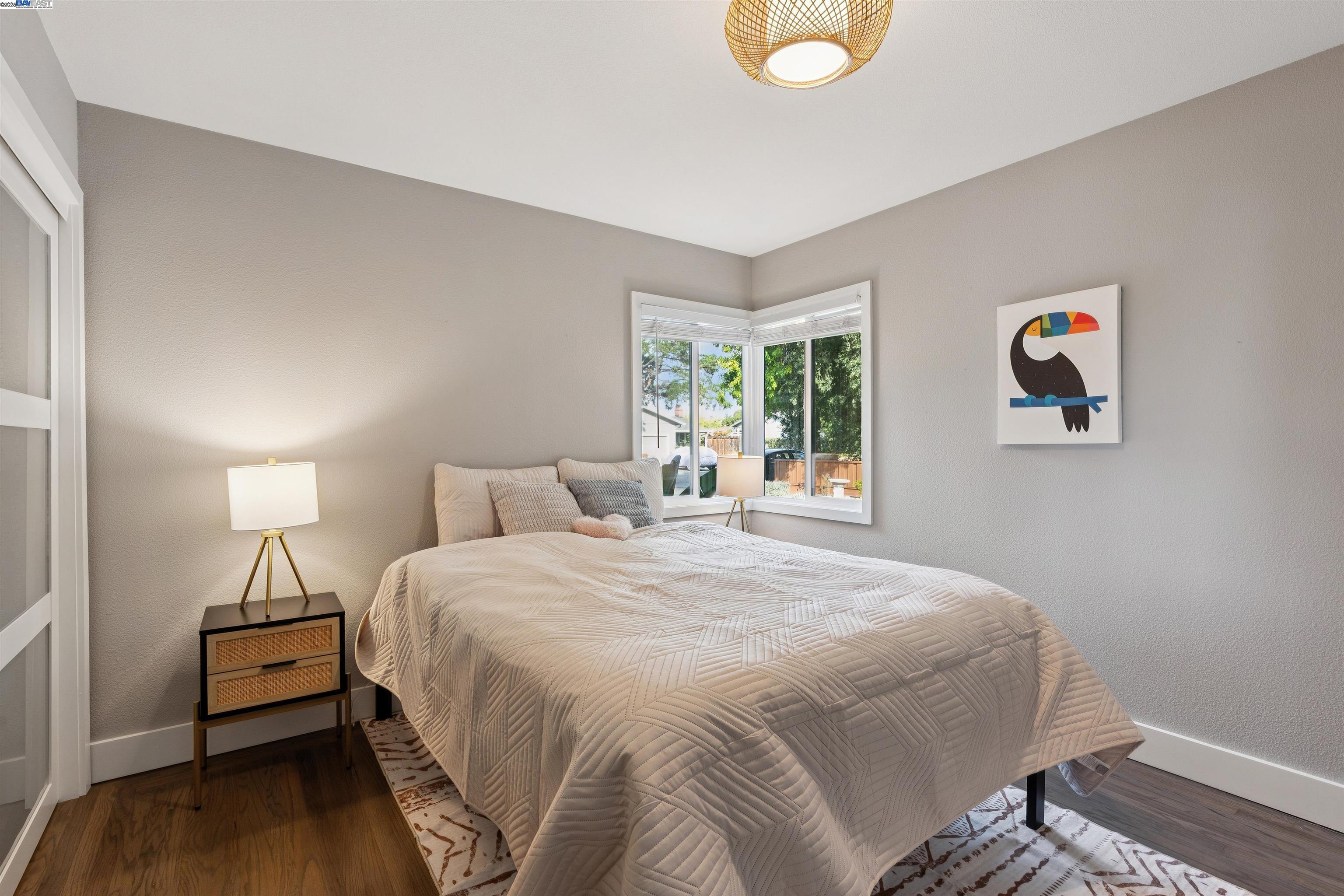 1230 Hale Drive Concord, CA 94518 - Photo 30 of 60 a bedroom with a bed and wooden floor