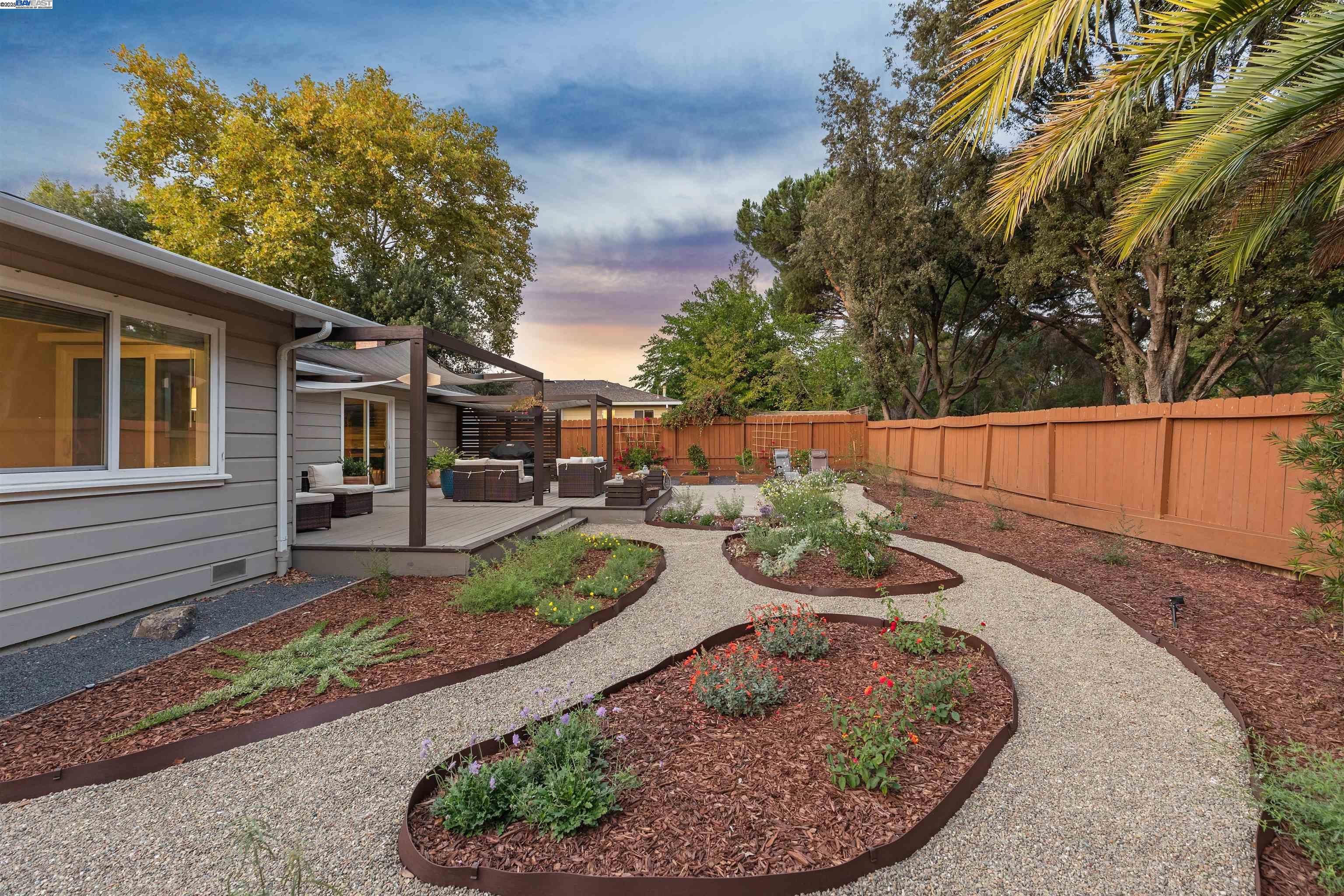 1230 Hale Drive Concord, CA 94518 - Photo 47 of 60 a view of a backyard with furniture and a garden