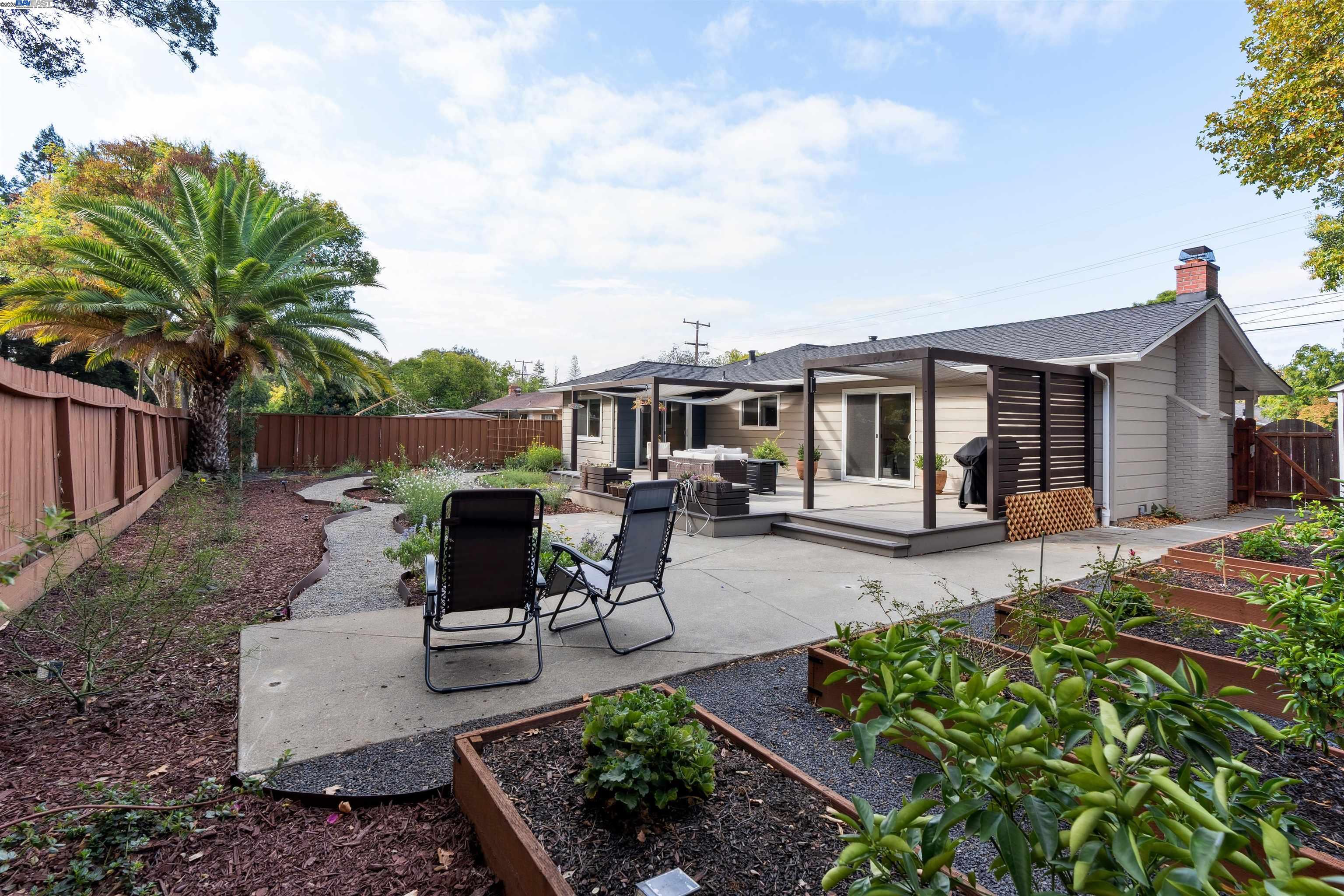 1230 Hale Drive Concord, CA 94518 - Photo 51 of 60 a view of a house with backyard sitting area and garden