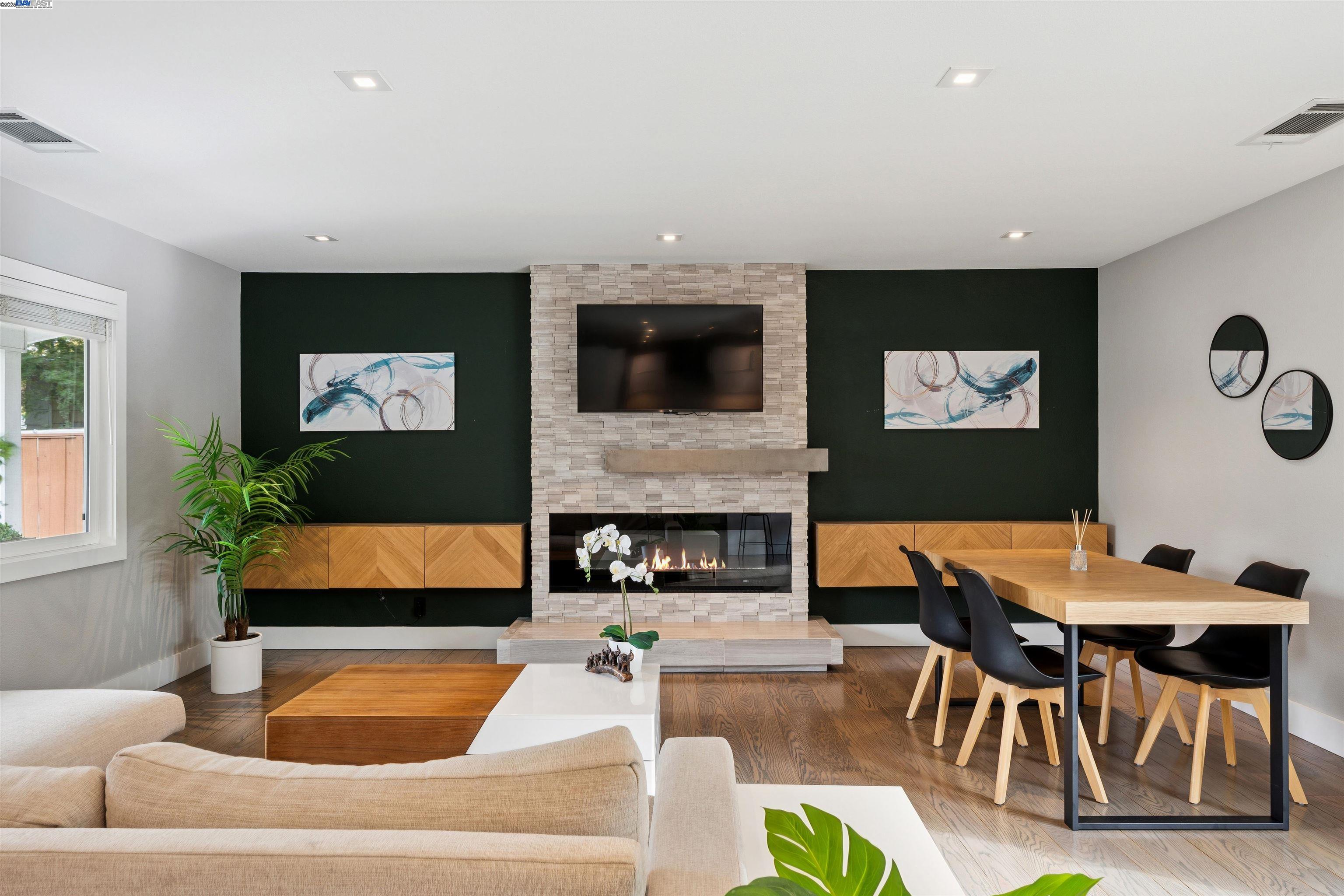 1230 Hale Drive Concord, CA 94518 - Photo 7 of 60 a living room with furniture a flat screen tv and a fireplace