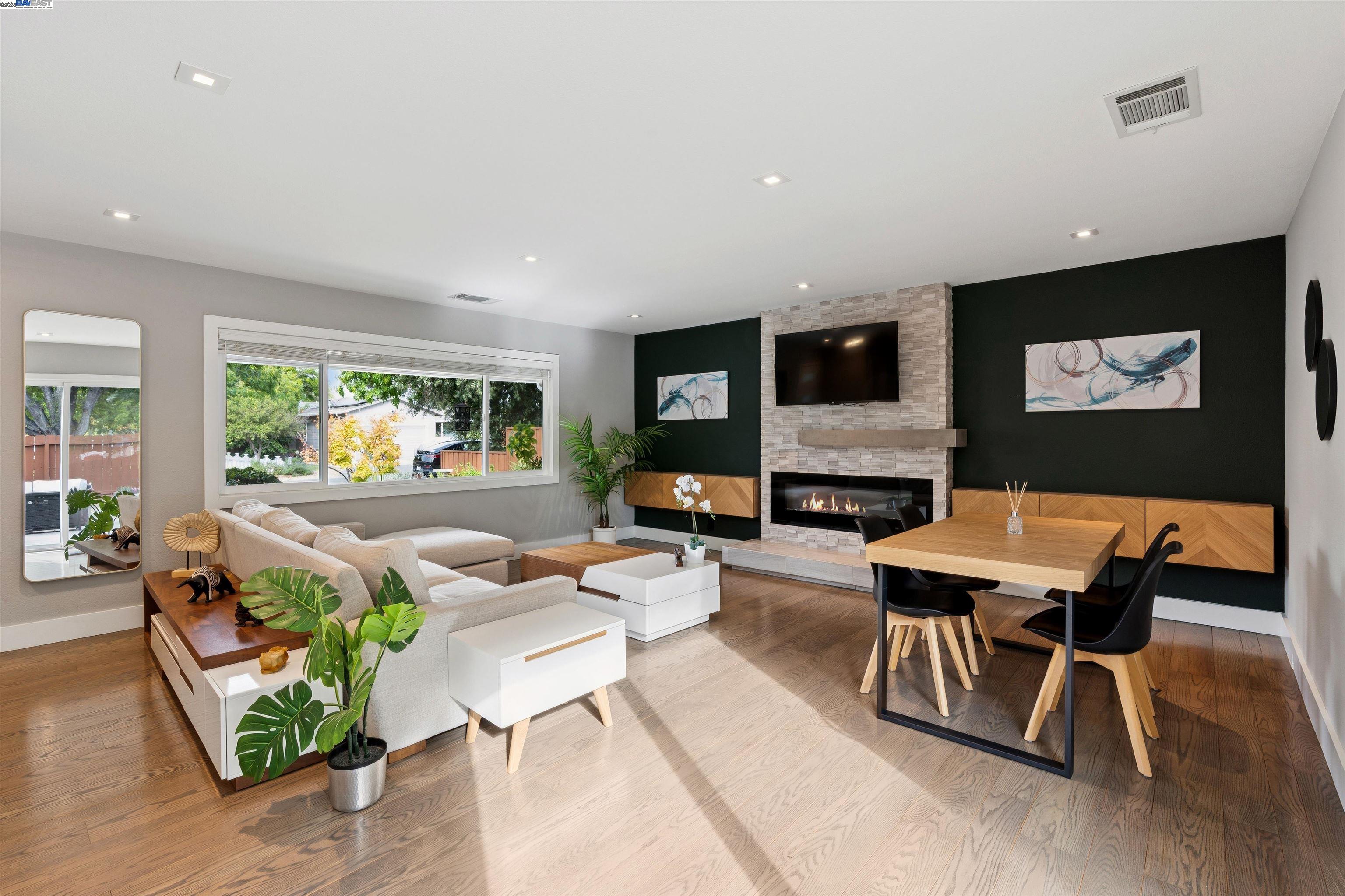 1230 Hale Drive Concord, CA 94518 - Photo 9 of 60 a living room with furniture a flat screen tv and a fireplace