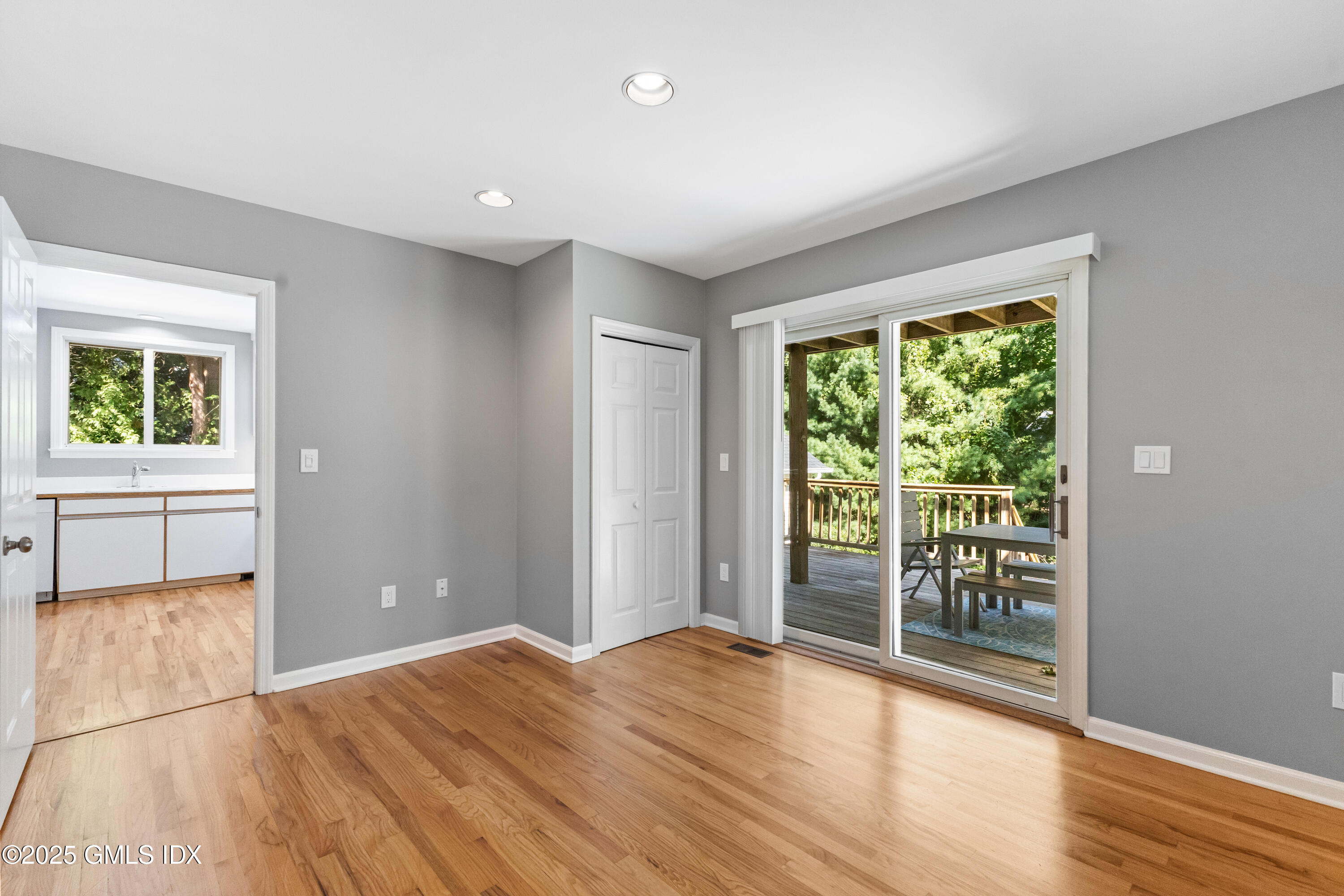 63 Riverside Avenue Riverside, CT 06878 - Photo 11 of 26 a view of empty room with wooden floor and fan