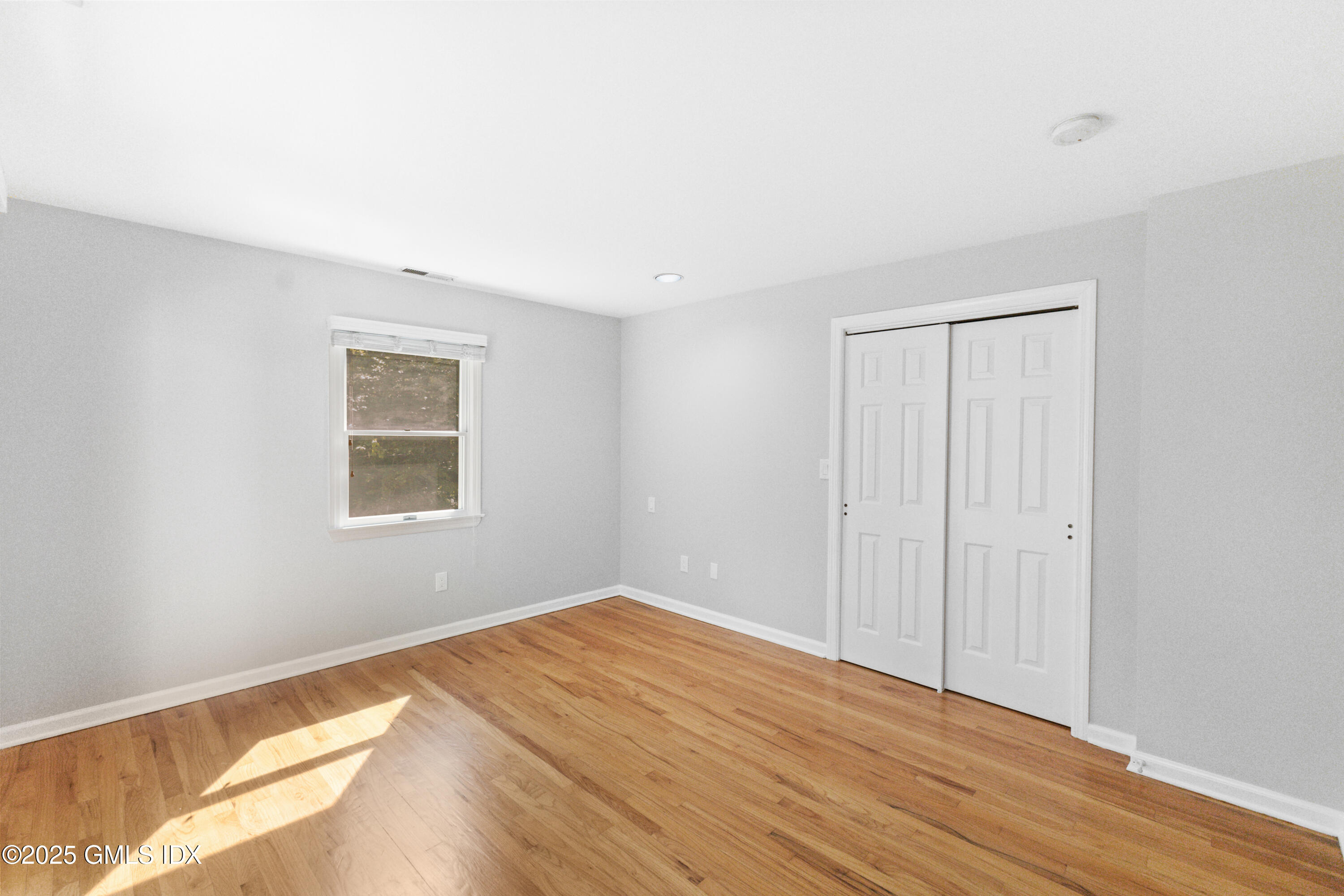 63 Riverside Avenue Riverside, CT 06878 - Photo 13 of 26 a view of a room with wooden floor and closet