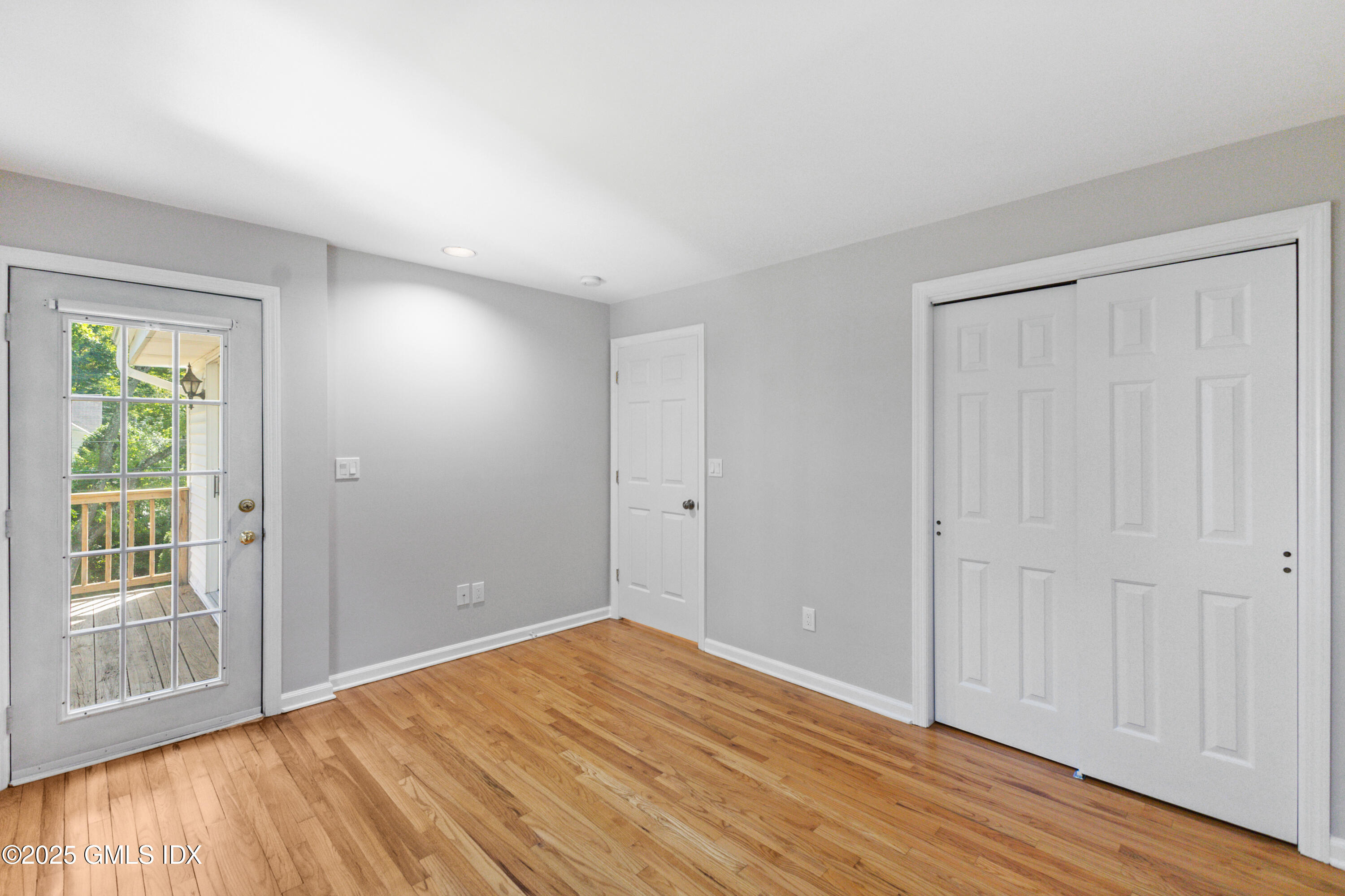 63 Riverside Avenue Riverside, CT 06878 - Photo 14 of 26 a view of empty room with wooden floor and fan