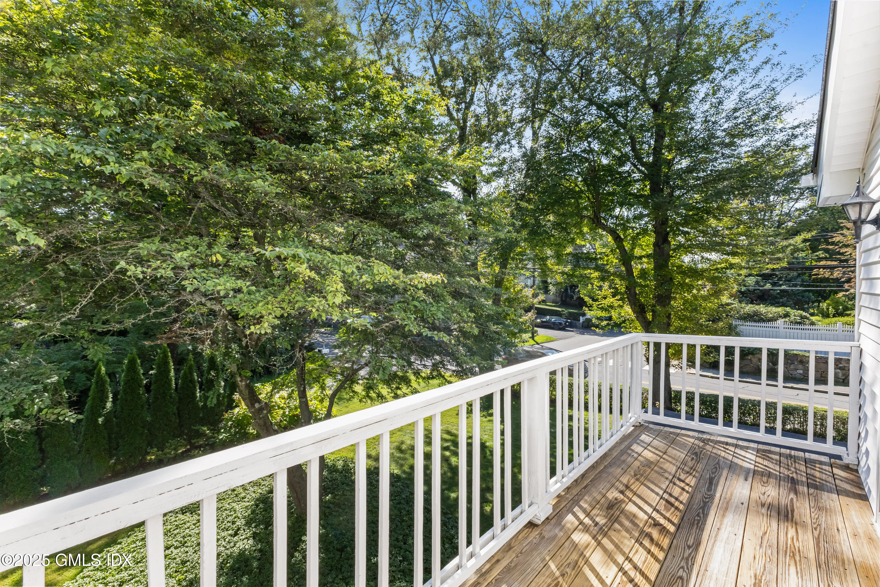 63 Riverside Avenue Riverside, CT 06878 - Photo 16 of 26 a view of balcony with deck and trees
