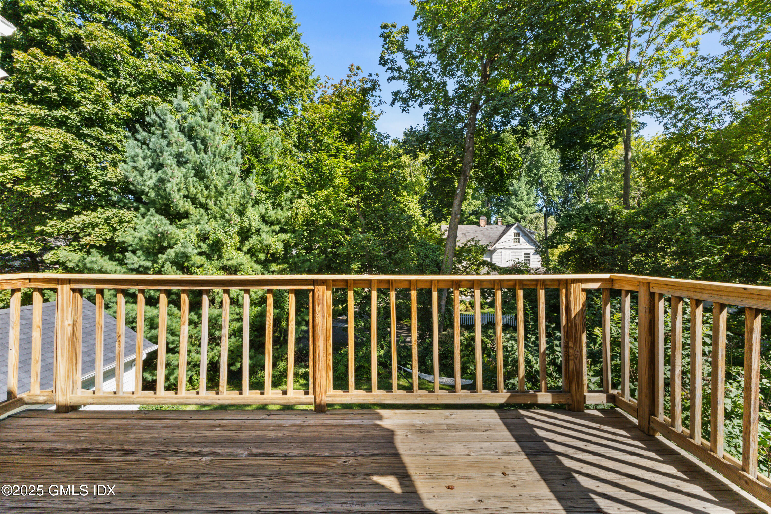 63 Riverside Avenue Riverside, CT 06878 - Photo 19 of 26 a balcony with wooden floor and fence