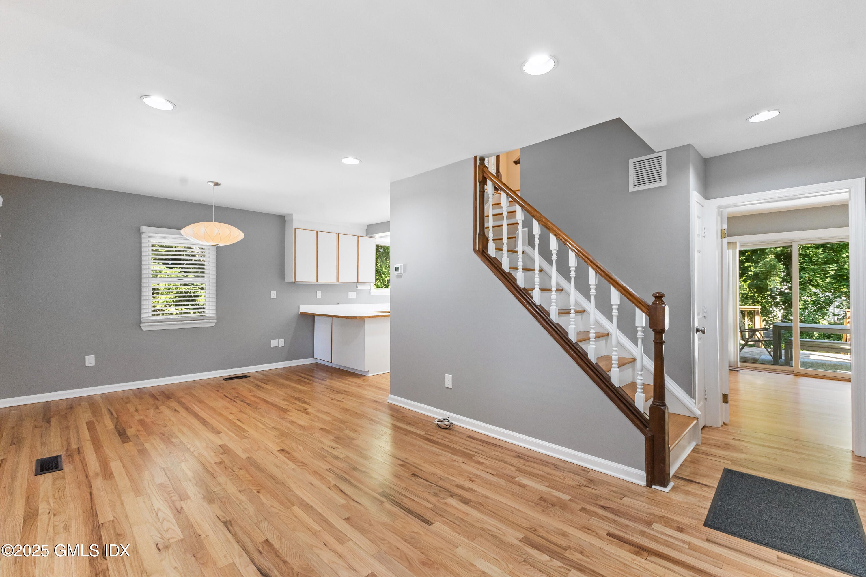 63 Riverside Avenue Riverside, CT 06878 - Photo 4 of 26 a view of an empty room with wooden floor and a window