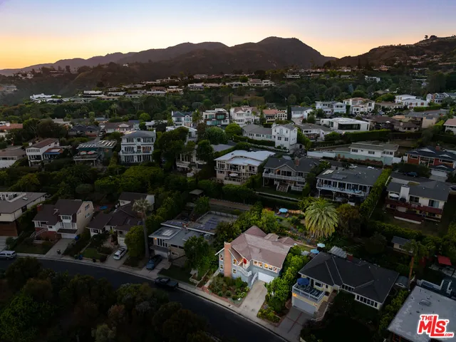a view of a house with a yard and plants