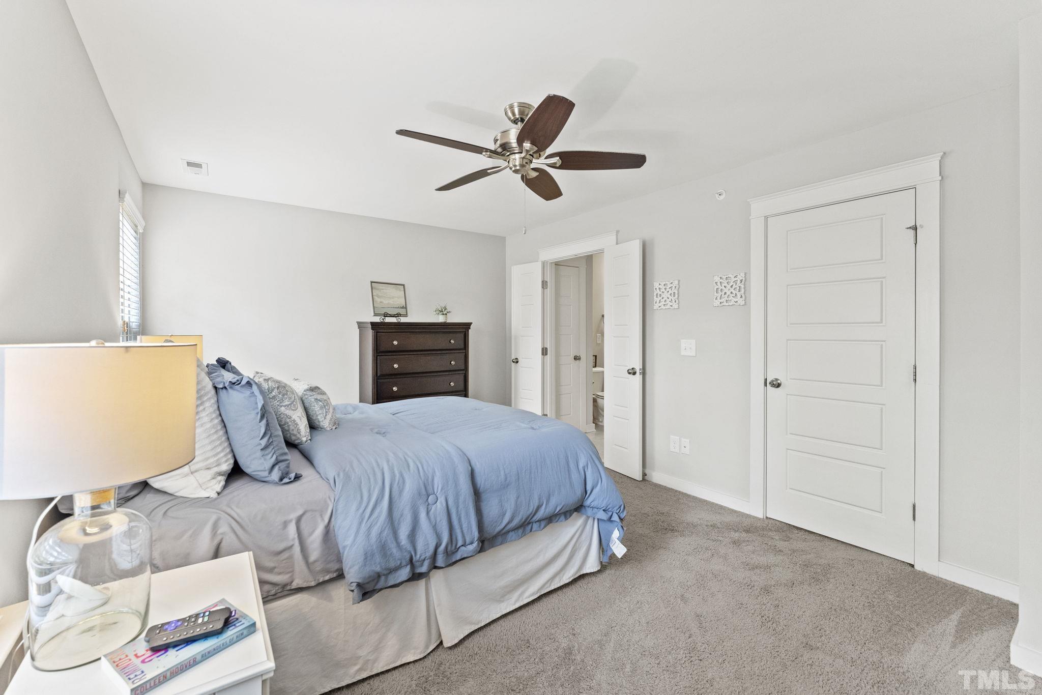 6329 Pesta Court Raleigh, NC 27612 - Photo 11 of 25 a bedroom with a bed and dresser