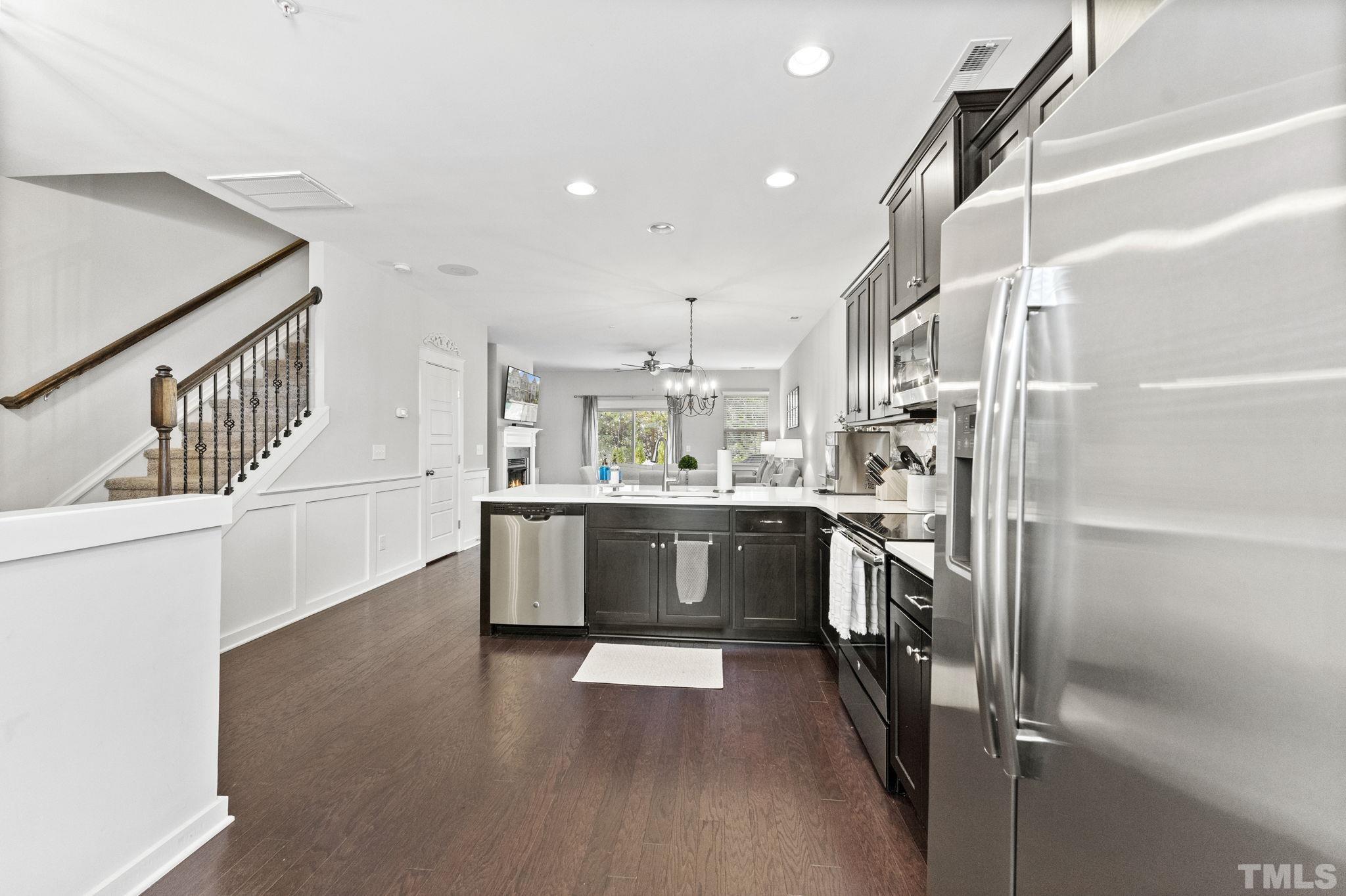 6329 Pesta Court Raleigh, NC 27612 - Photo 3 of 25 a large kitchen with a large window and stainless steel appliances