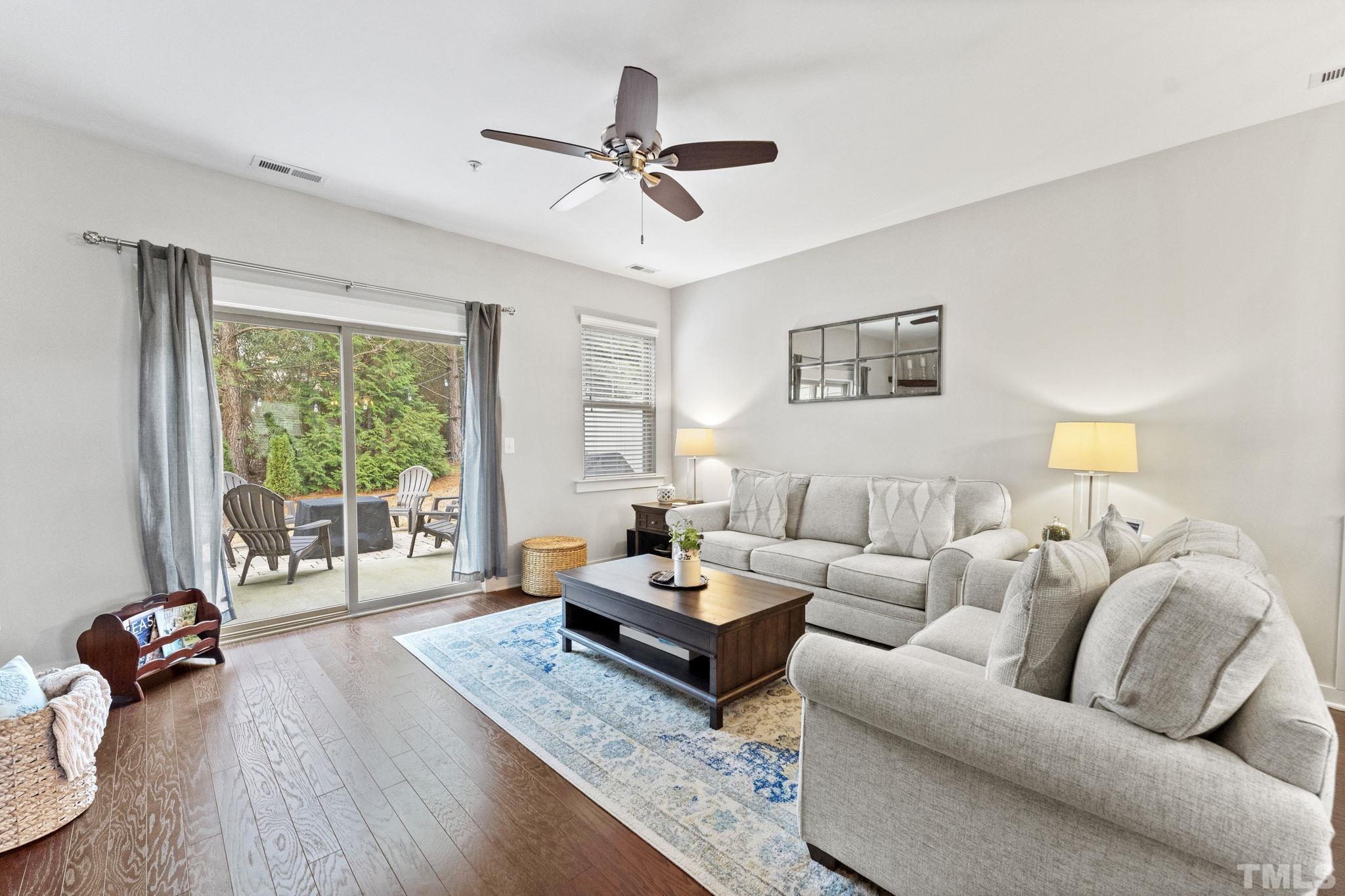 6329 Pesta Court Raleigh, NC 27612 - Photo 6 of 25 a living room with furniture and a large window