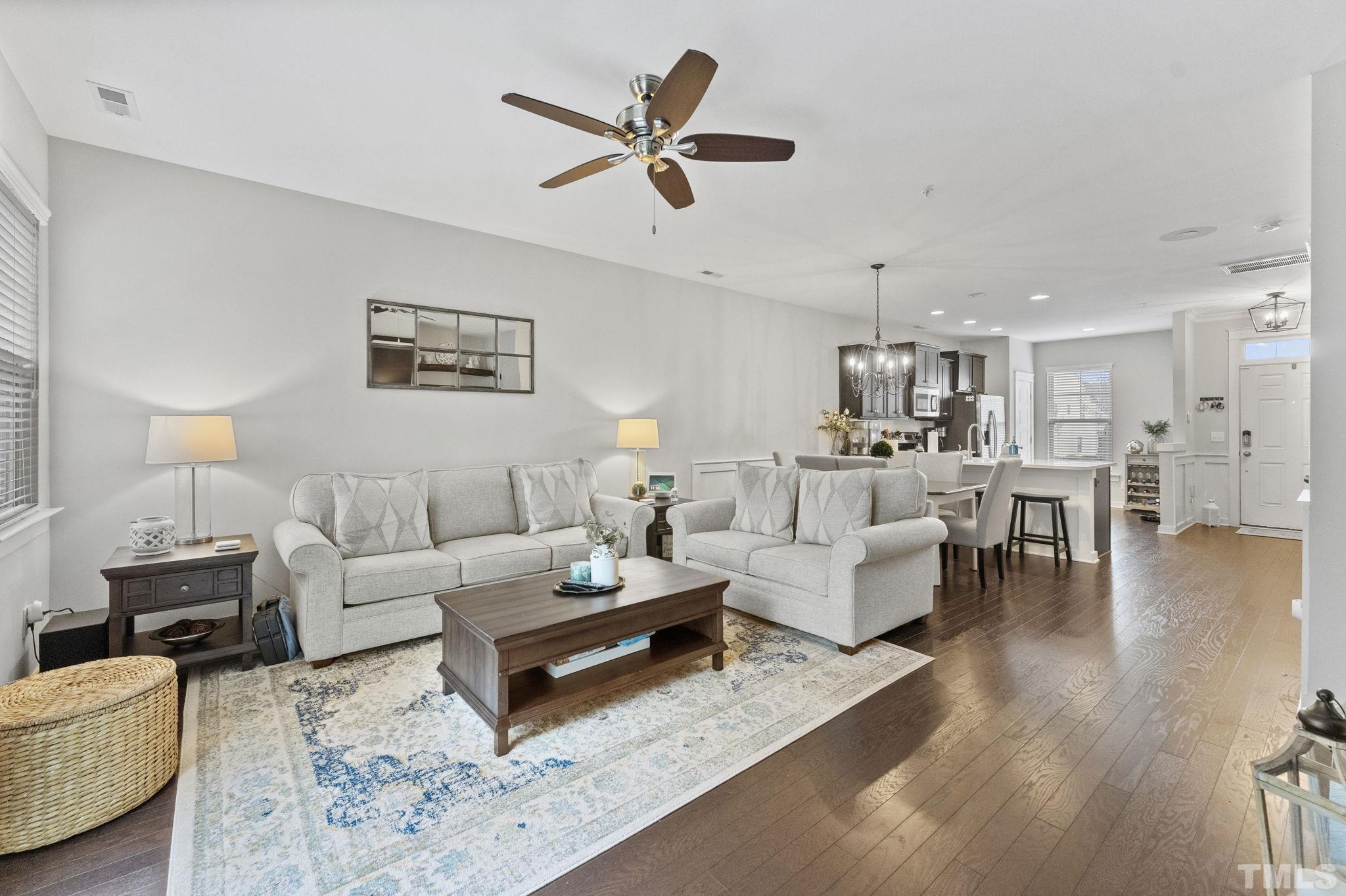 6329 Pesta Court Raleigh, NC 27612 - Photo 7 of 25 a living room with furniture or kitchen view and a wooden floor