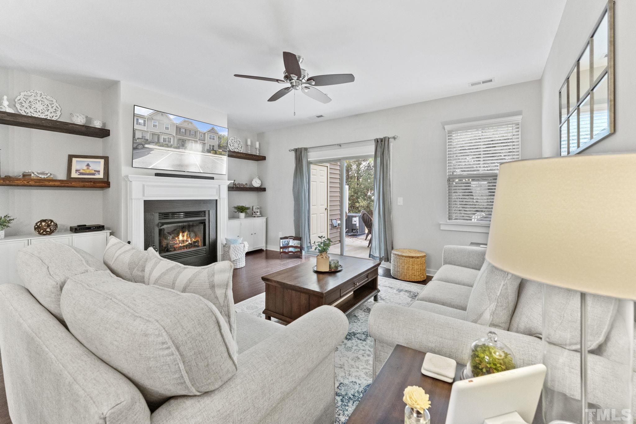 6329 Pesta Court Raleigh, NC 27612 - Photo 8 of 25 a living room with furniture and a fireplace