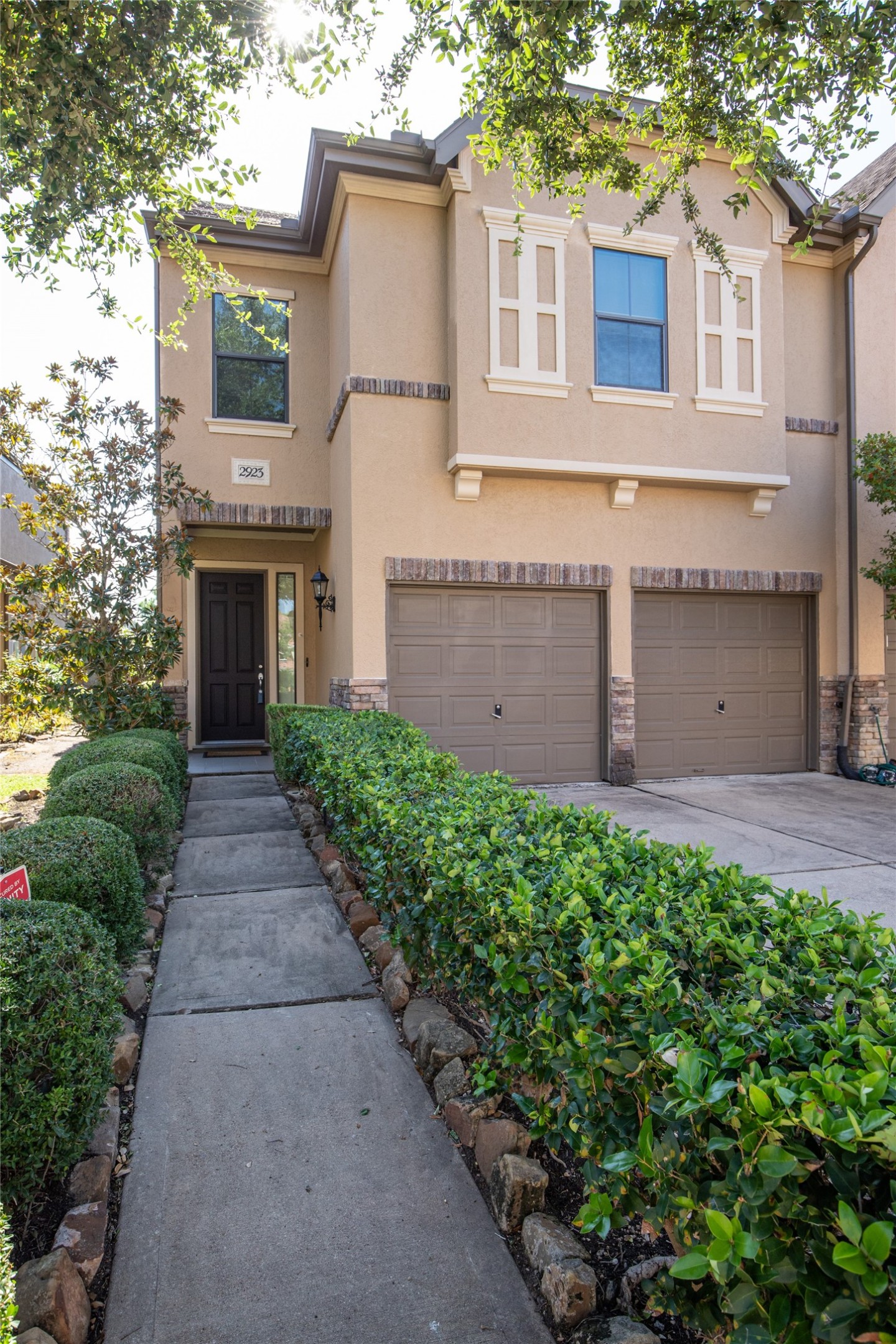 2923 Royal Oaks Crest Houston, TX 77082 - Photo 2 of 31 a view of a house with a garden
