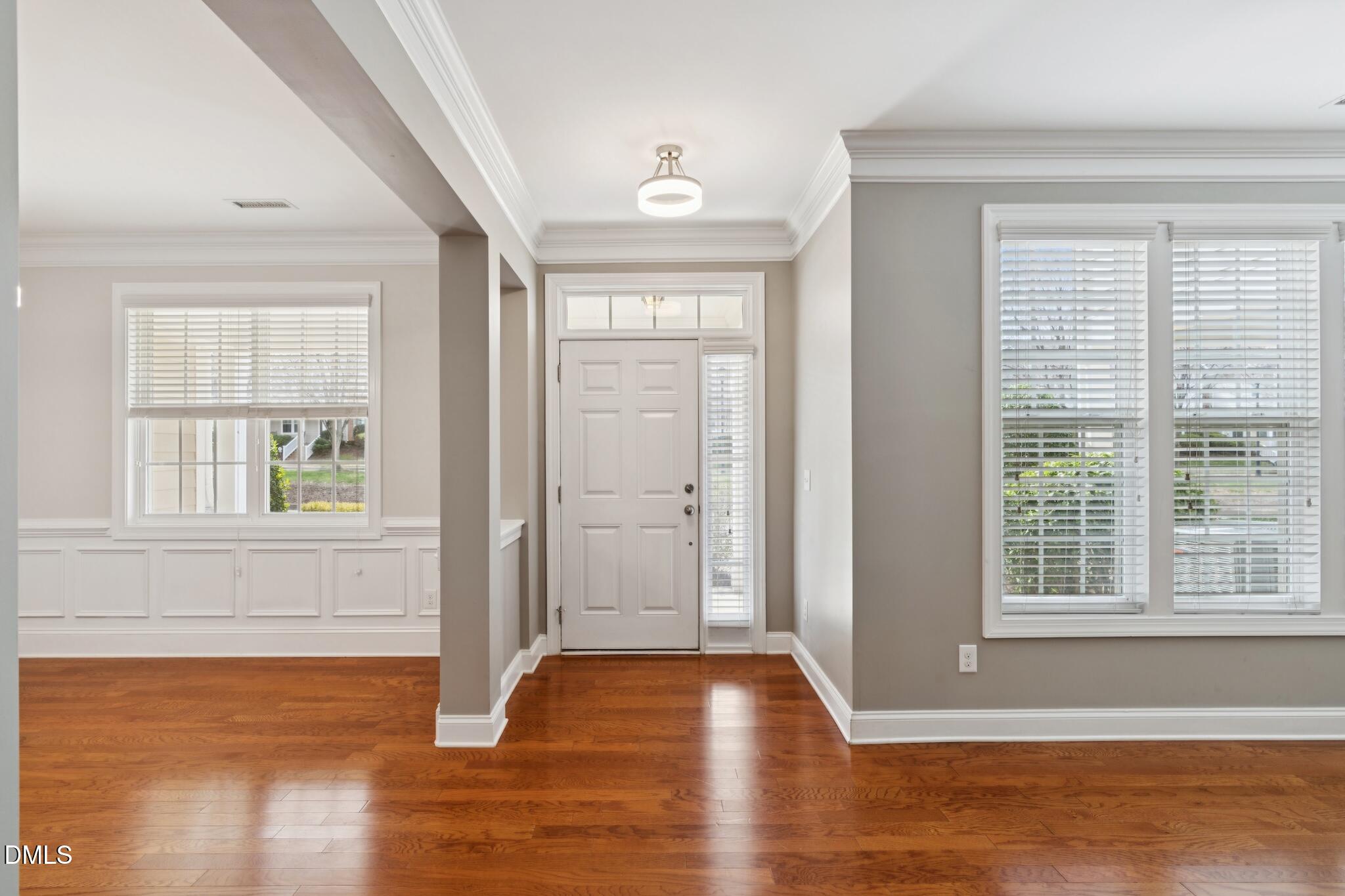 616 Democracy Street Raleigh, NC 27603 - Photo 12 of 61 a view of empty room with wooden floor and fan