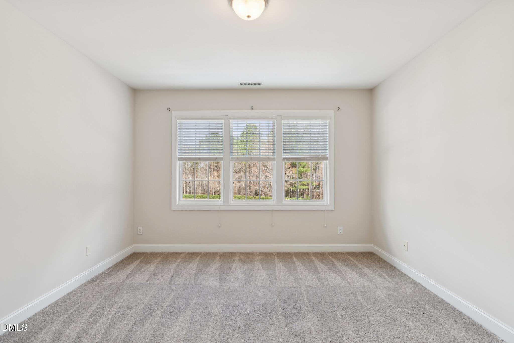 616 Democracy Street Raleigh, NC 27603 - Photo 39 of 61 an empty room with a window