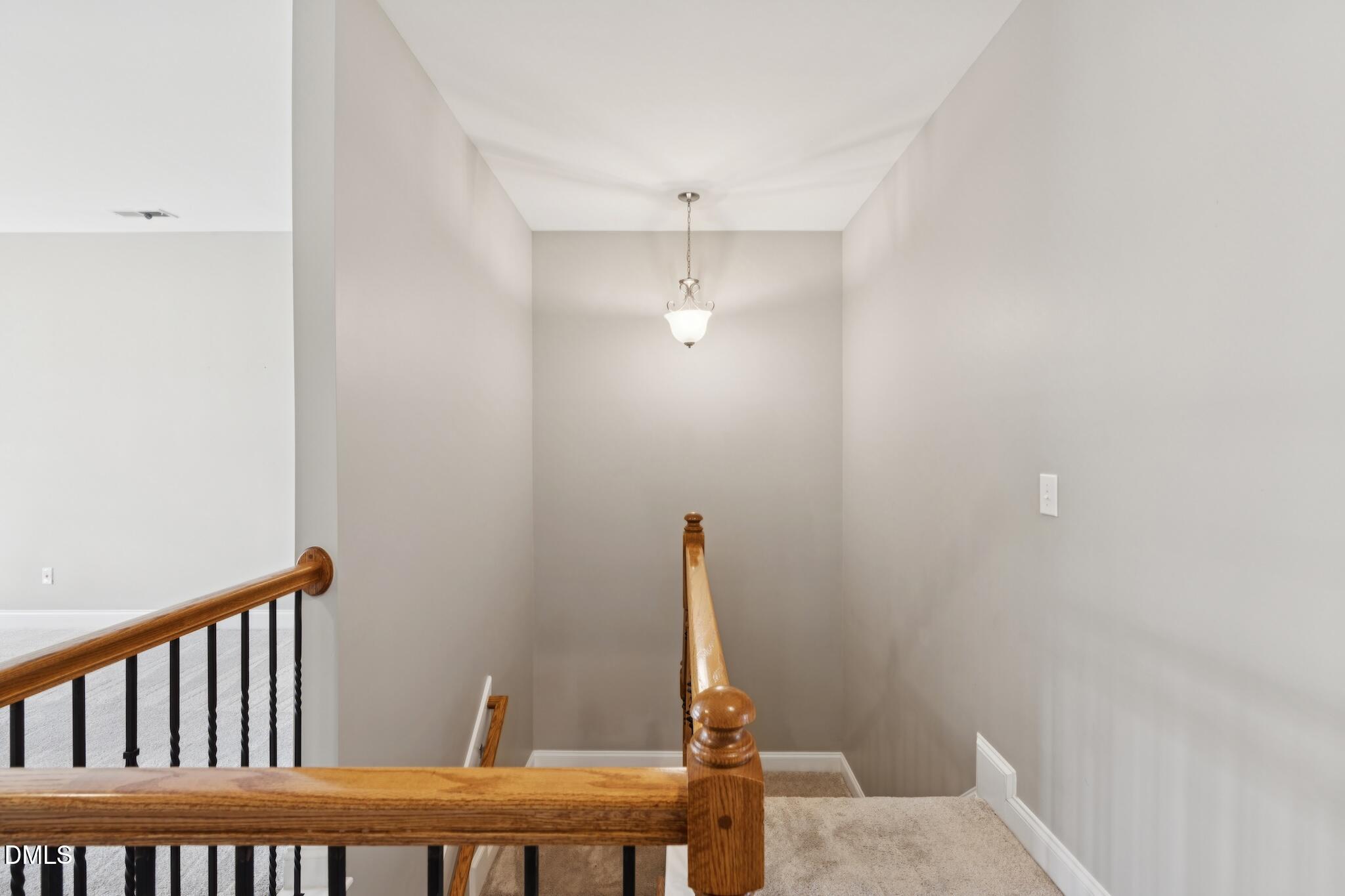 616 Democracy Street Raleigh, NC 27603 - Photo 43 of 61 a view of a hallway with a table