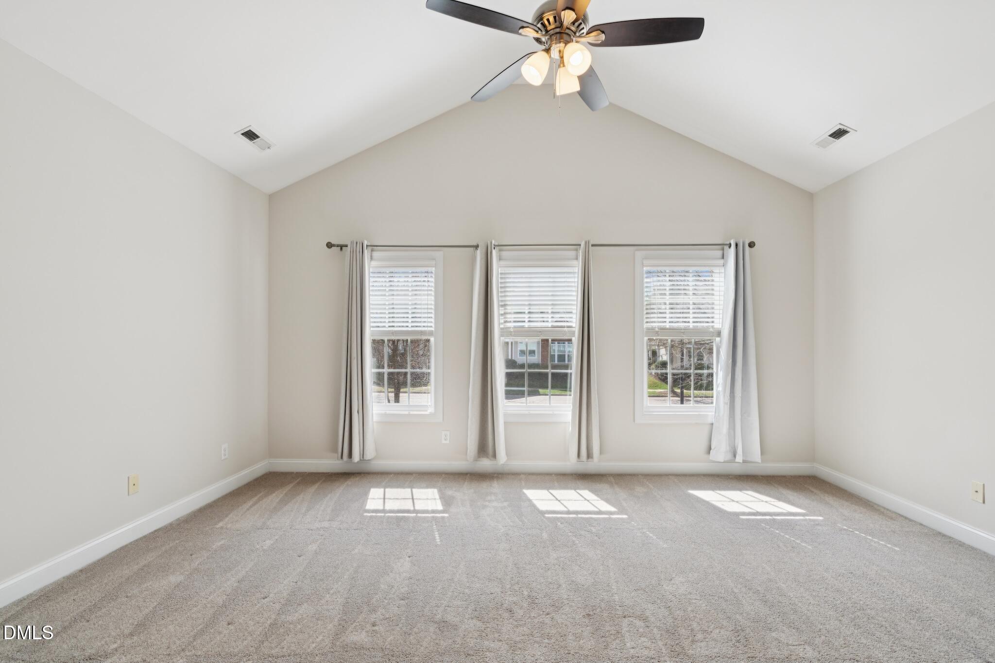 616 Democracy Street Raleigh, NC 27603 - Photo 53 of 61 an empty room with windows and fan