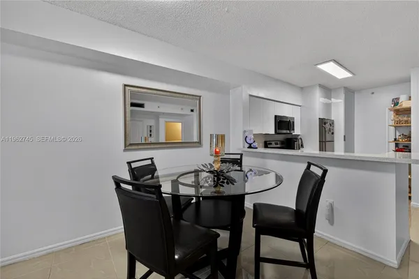 a dining room with furniture and window