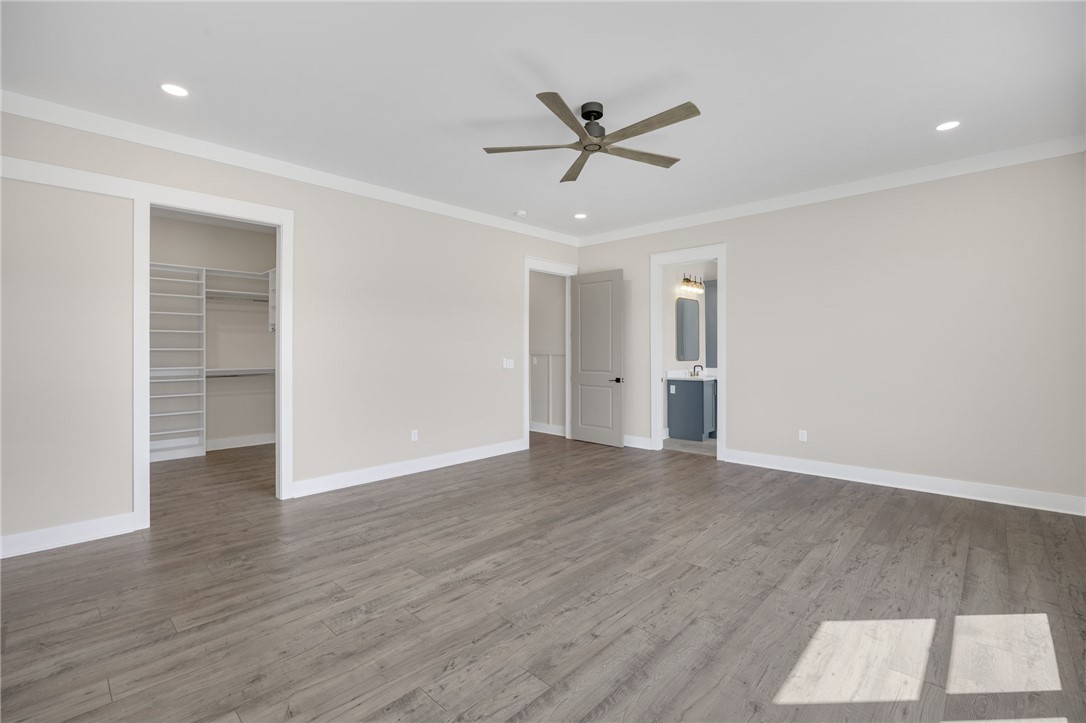 384 Jim Smith Road Pendleton, SC 29670 - Photo 15 of 48 Gleaming wood-look floors anchor a spacious suite complete with a custom walk-in closet.
