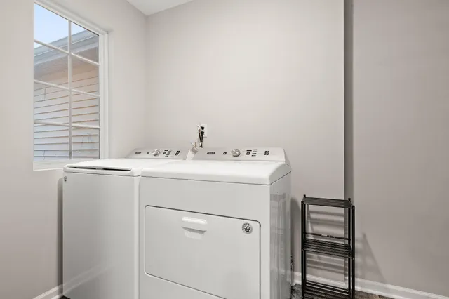 a spacious bedroom with a bed and a large window