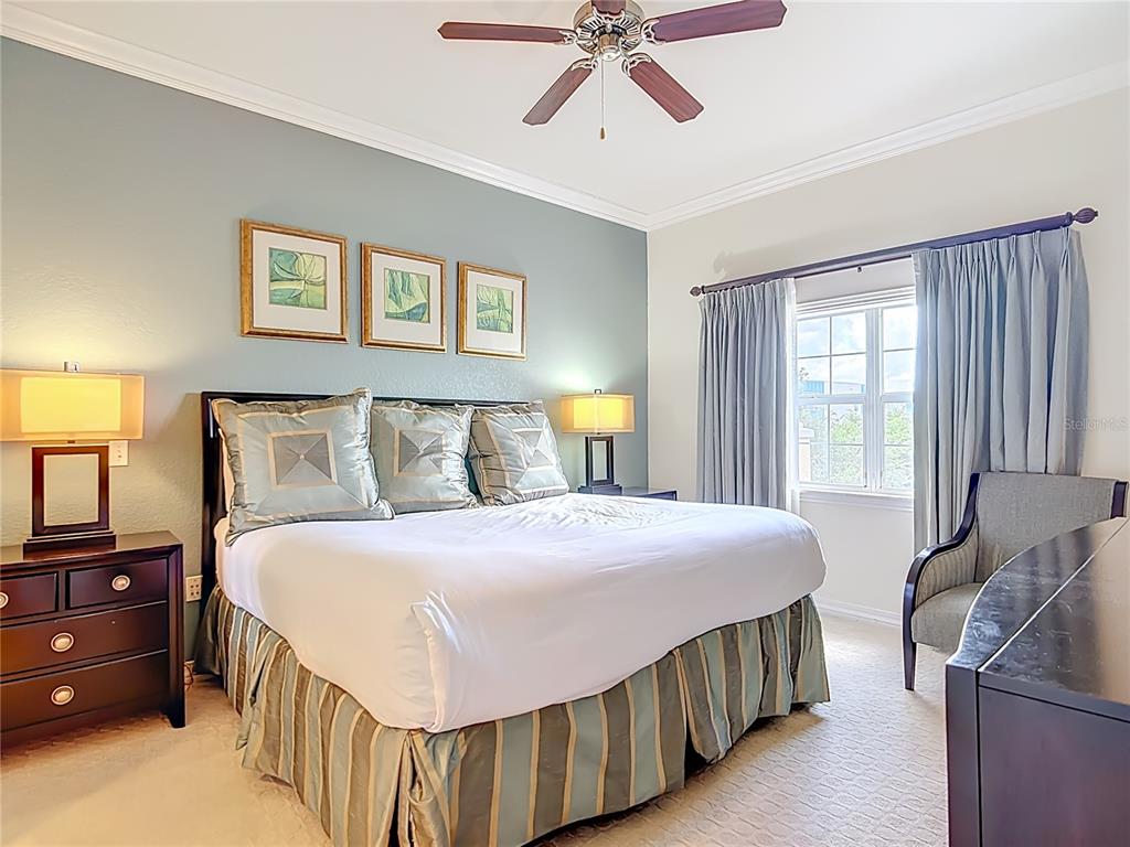 1116 Sunset View Circle, Unit 304 Reunion, FL 34747 - Photo 19 of 37 a bedroom with a bed and window