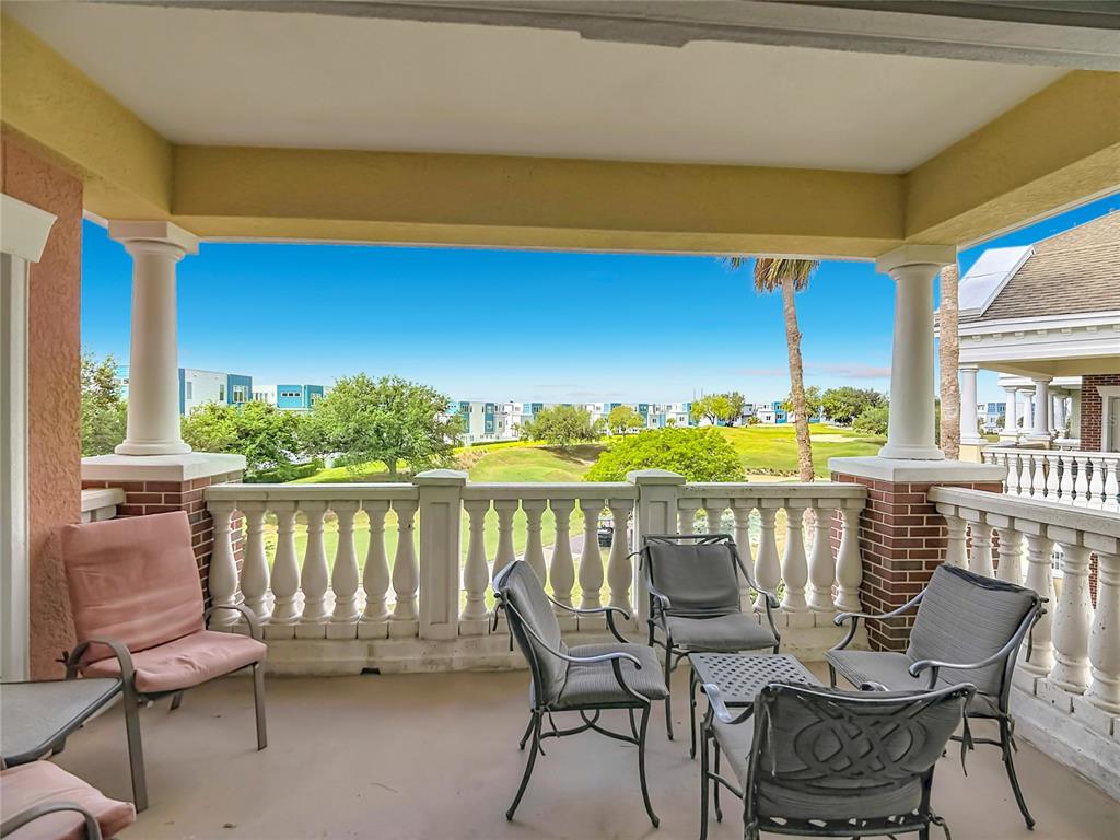 1116 Sunset View Circle, Unit 304 Reunion, FL 34747 - Photo 36 of 37 a balcony with chairs