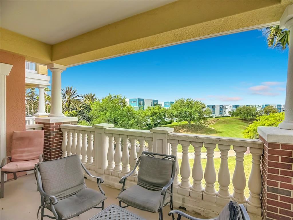 1116 Sunset View Circle, Unit 304 Reunion, FL 34747 - Photo 37 of 37 a view of a chairs and table in patio