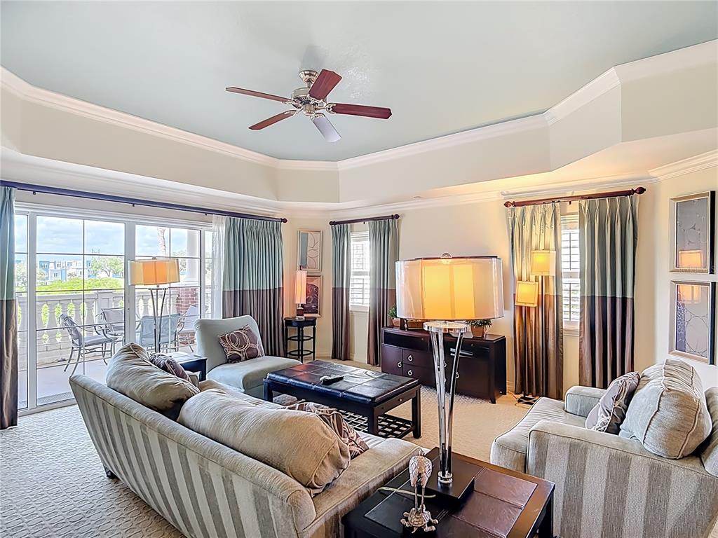 1116 Sunset View Circle, Unit 304 Reunion, FL 34747 - Photo 6 of 37 a living room with furniture and a flat screen tv
