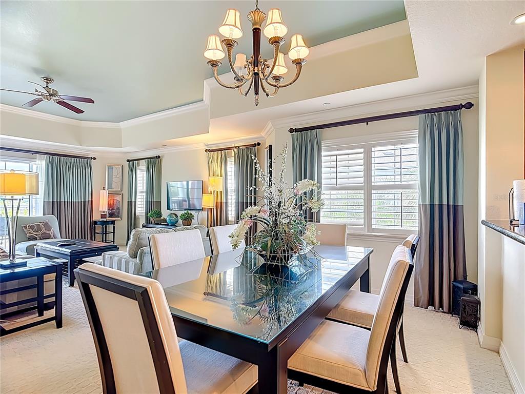 1116 Sunset View Circle, Unit 304 Reunion, FL 34747 - Photo 7 of 37 a view of a dining room with furniture window and outside view
