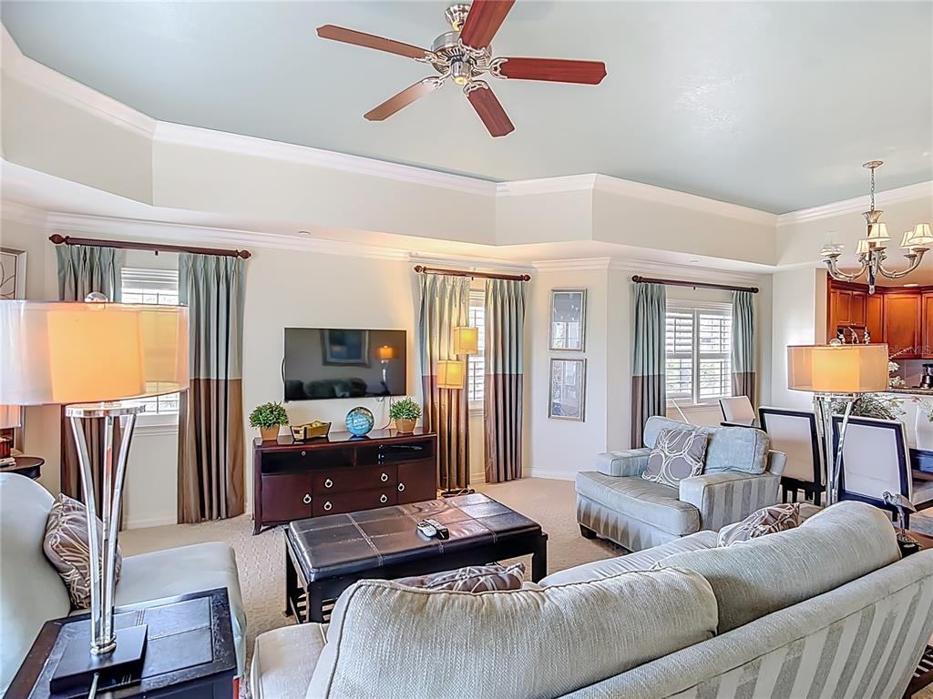 1116 Sunset View Circle, Unit 304 Reunion, FL 34747 - Photo 8 of 37 a living room with furniture flat screen tv and window