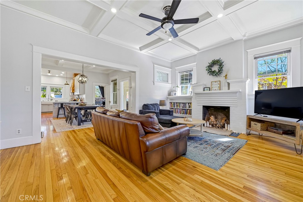 303 West 21st Street Merced, CA 95340 - Photo 24 of 52 a living room with furniture a flat screen tv and a fireplace