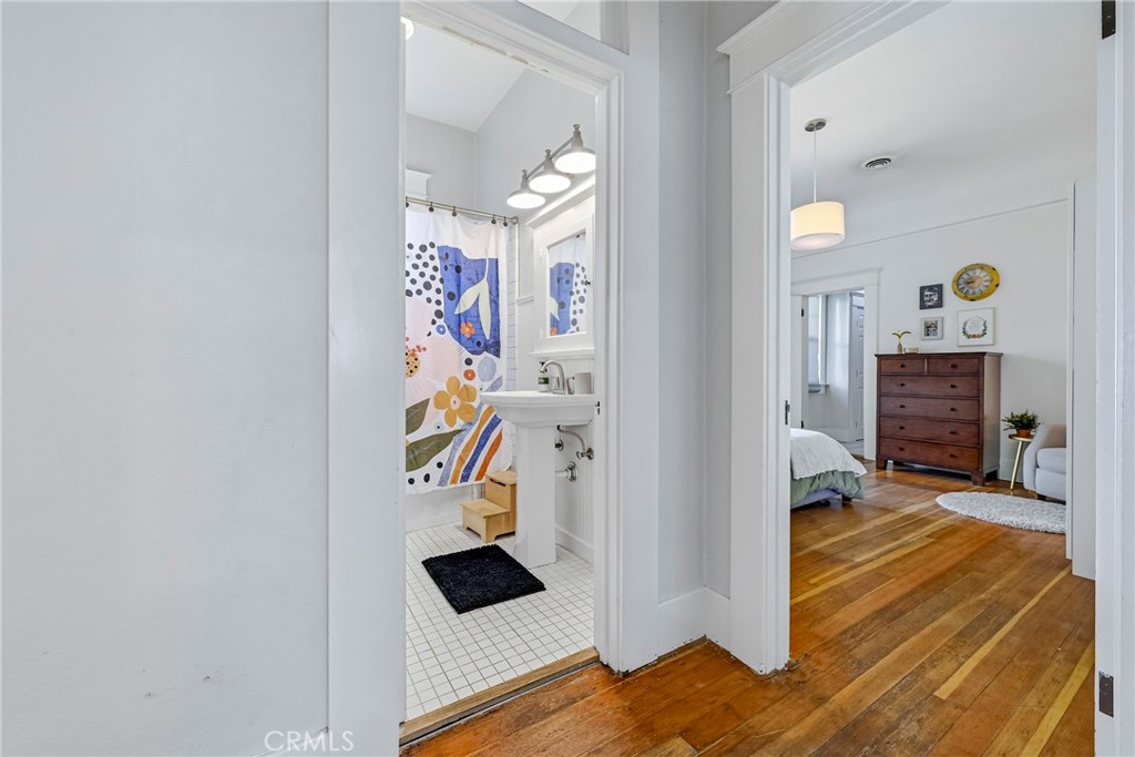 303 West 21st Street Merced, CA 95340 - Photo 27 of 52 a view of a livingroom with wooden floor and a ceiling fan