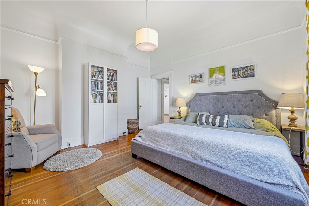 303 West 21st Street Merced, CA 95340 - Photo 30 of 52 a bedroom with a bed and a chandelier