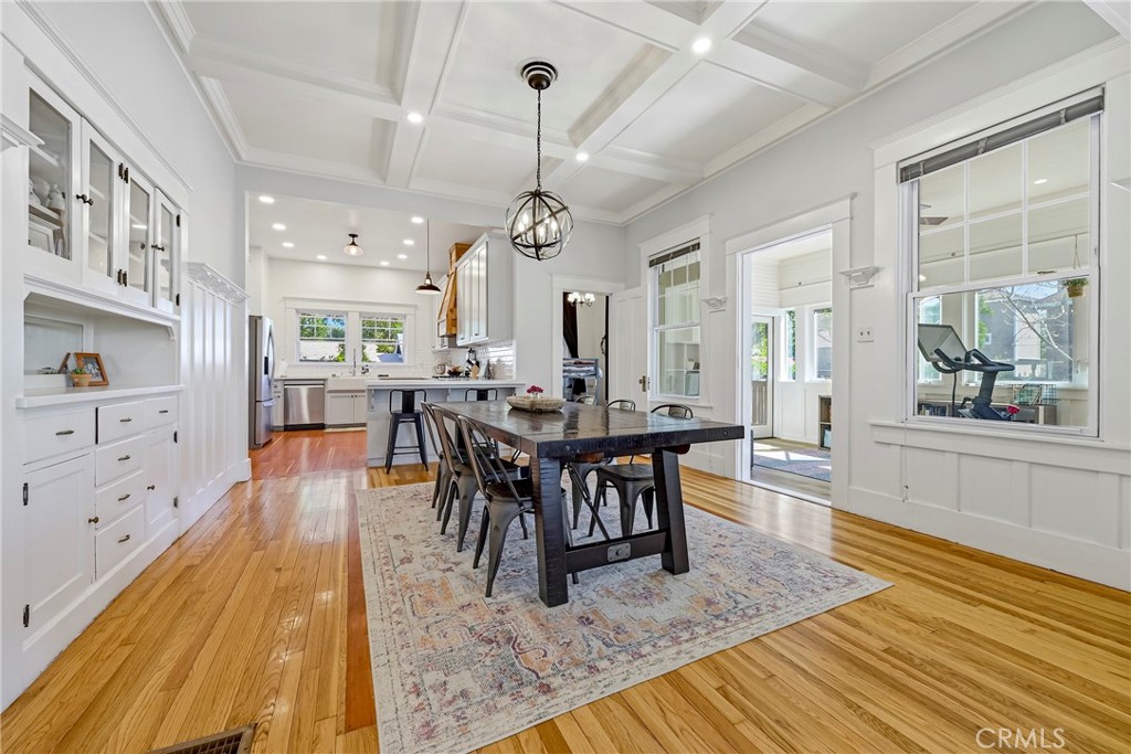 303 West 21st Street Merced, CA 95340 - Photo 37 of 52 a view of a a dining room and livingroom with furniture wooden floor a chandelier