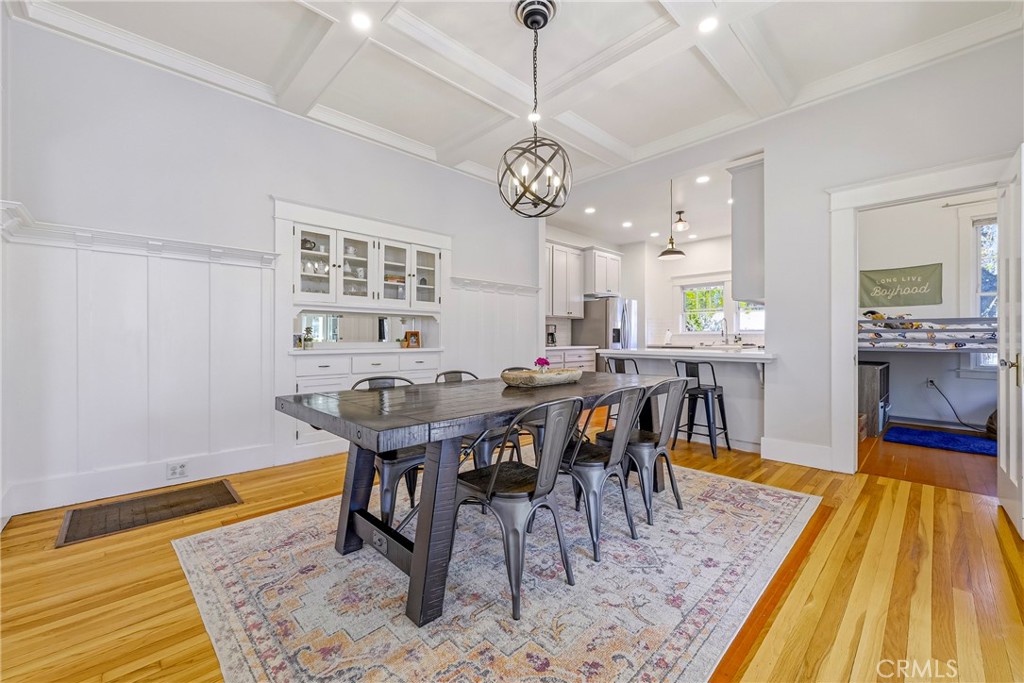 303 West 21st Street Merced, CA 95340 - Photo 39 of 52 a view of a dining room with furniture and wooden floor