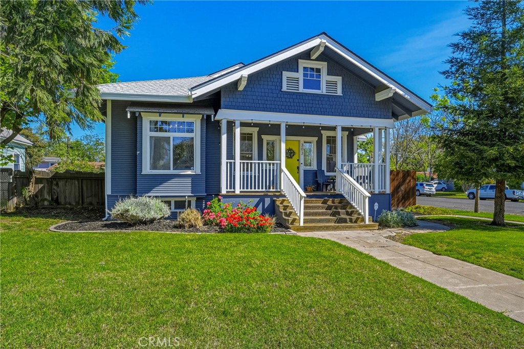 303 West 21st Street Merced, CA 95340 - Photo 4 of 52 a front view of a house with garden and porch