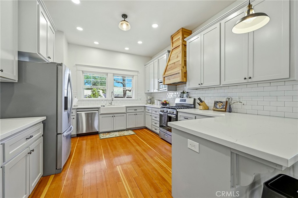 303 West 21st Street Merced, CA 95340 - Photo 43 of 52 a kitchen with stainless steel appliances a refrigerator sink and cabinets