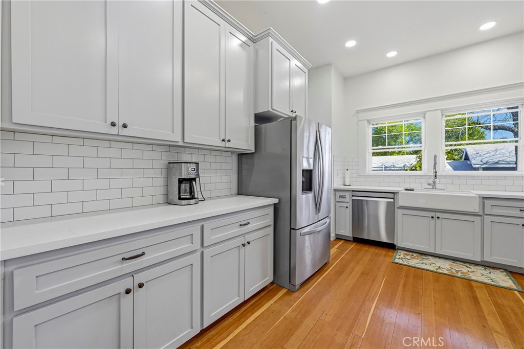 303 West 21st Street Merced, CA 95340 - Photo 44 of 52 a kitchen with stainless steel appliances a refrigerator sink and cabinets