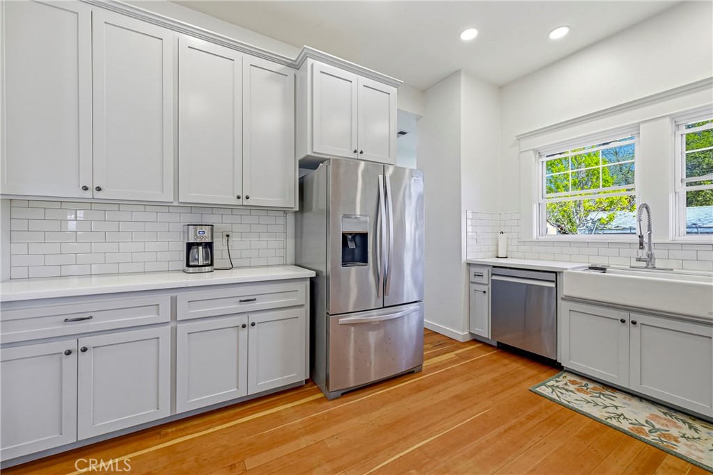 303 West 21st Street Merced, CA 95340 - Photo 46 of 52 a kitchen with stainless steel appliances granite countertop a refrigerator sink and cabinets